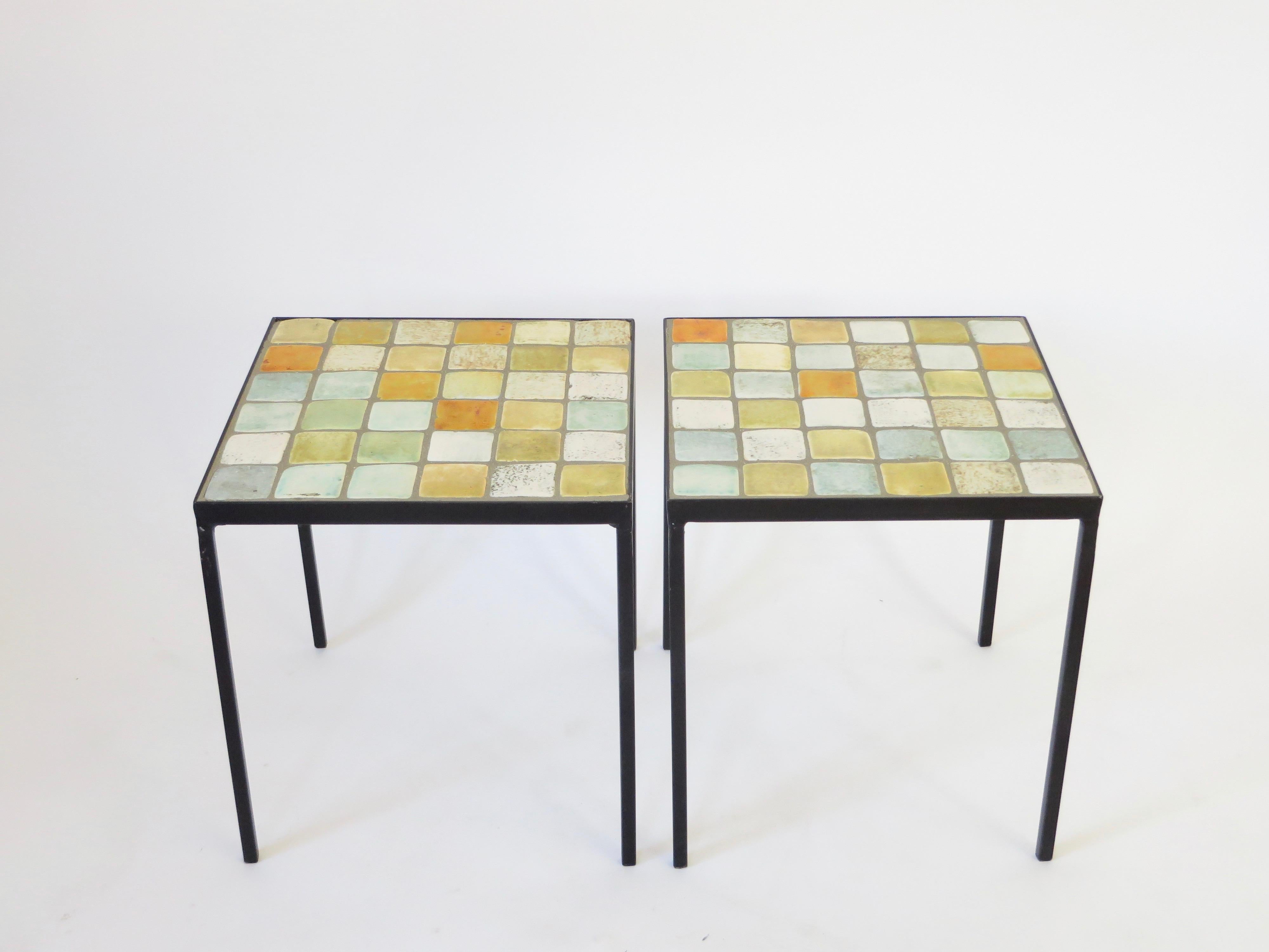 Colorful glazed ceramic tile end or side table with metal table base by French ceramic artists Les 2 Potiers.
Jacques and Michelle Serre.
Small square multi-color tiles compose the tops of the table and have a black iron frame,
circa