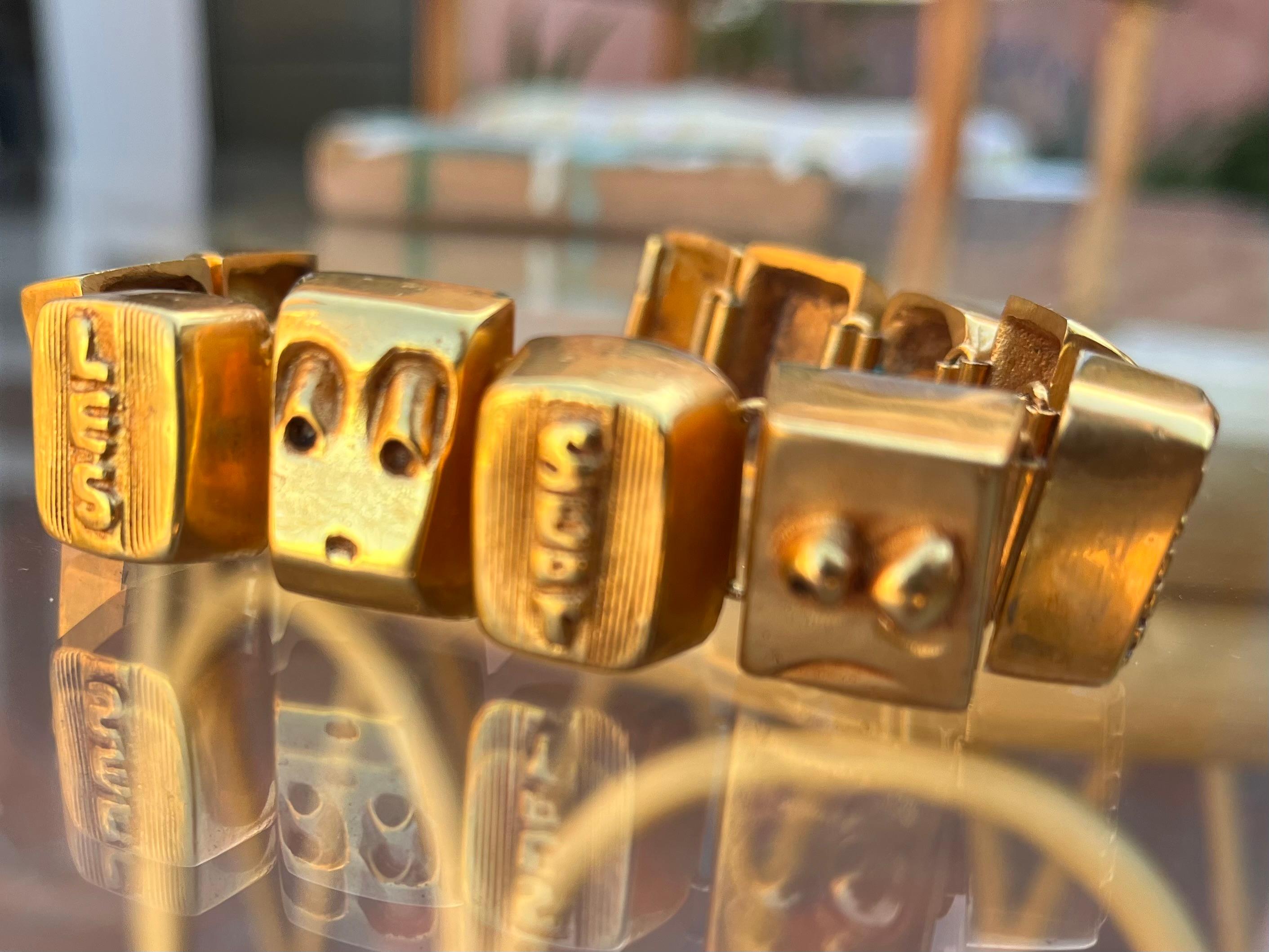 Bracelet Les sept péchés capitaux par Line Vautrin - Circa 1950 - Bronze doré - Signé

Chaque partie du bracelet illustre l'un des 7 péchés capitaux