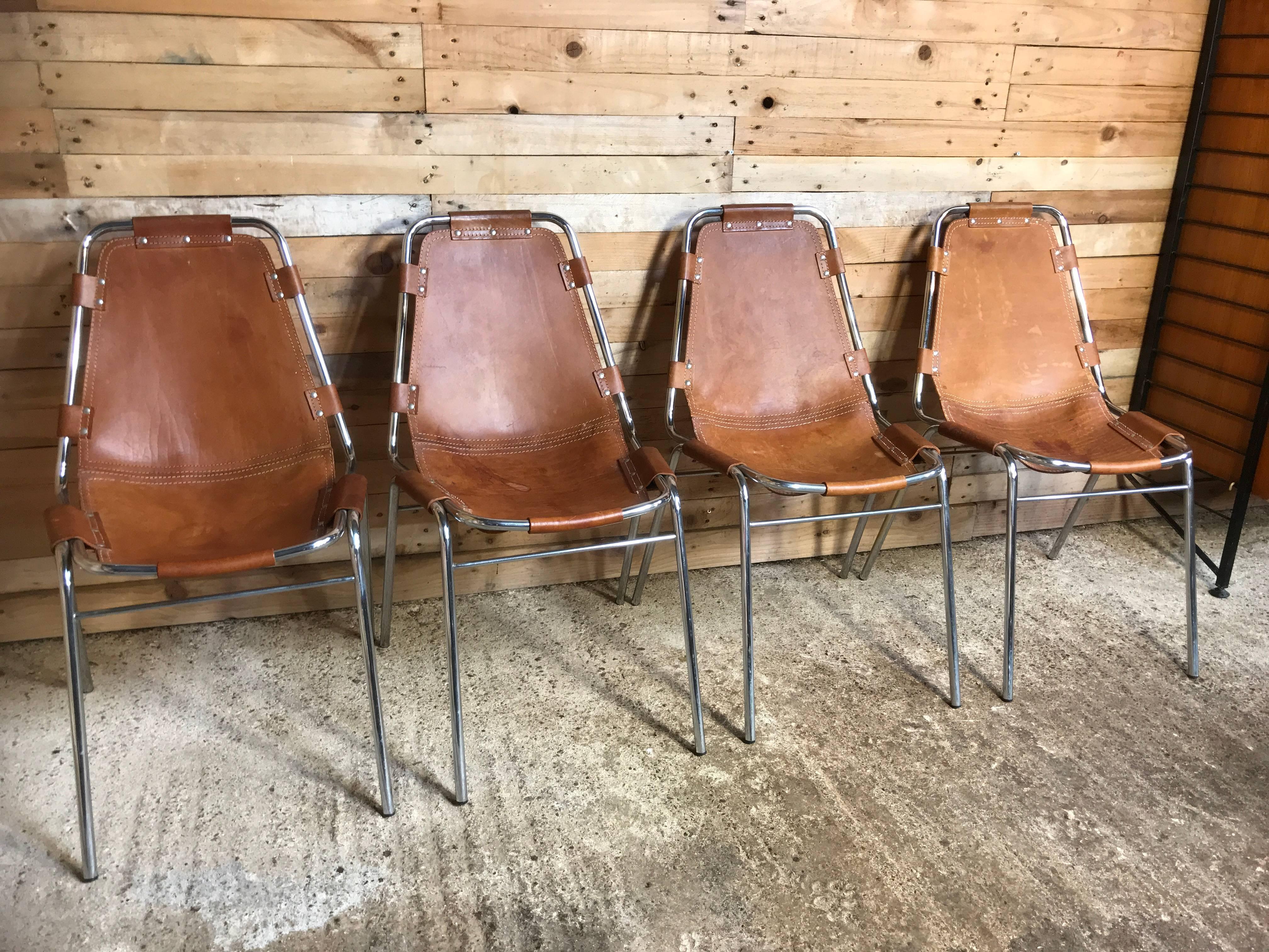 Stunning set of chairs, difficult to find a set of four chairs like this on any web site worldwide! designed / chosen by Charlotte Perriand for and used in the Ski Resort Les Arcs, circa 1960. 

These chairs were commissioned to be made by DalVera.