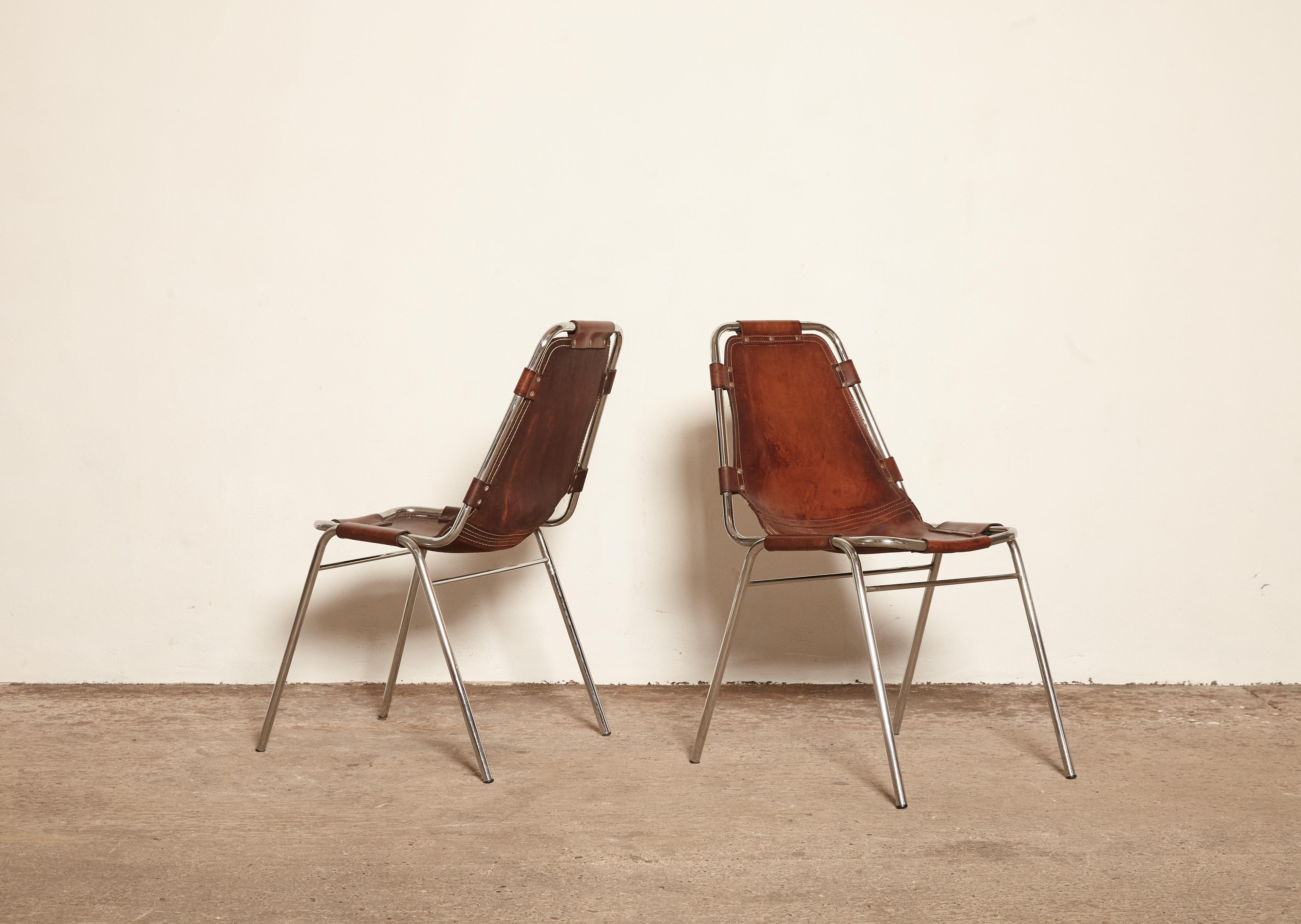 'Les Arcs' chairs in tubular steel and cognac leather, France/Italy, 1970s. Patinated original leather. 

Priced per chair.   Two are available.

Les Arcs was a project on which Charlotte Perriand collaborated with some other architects who
