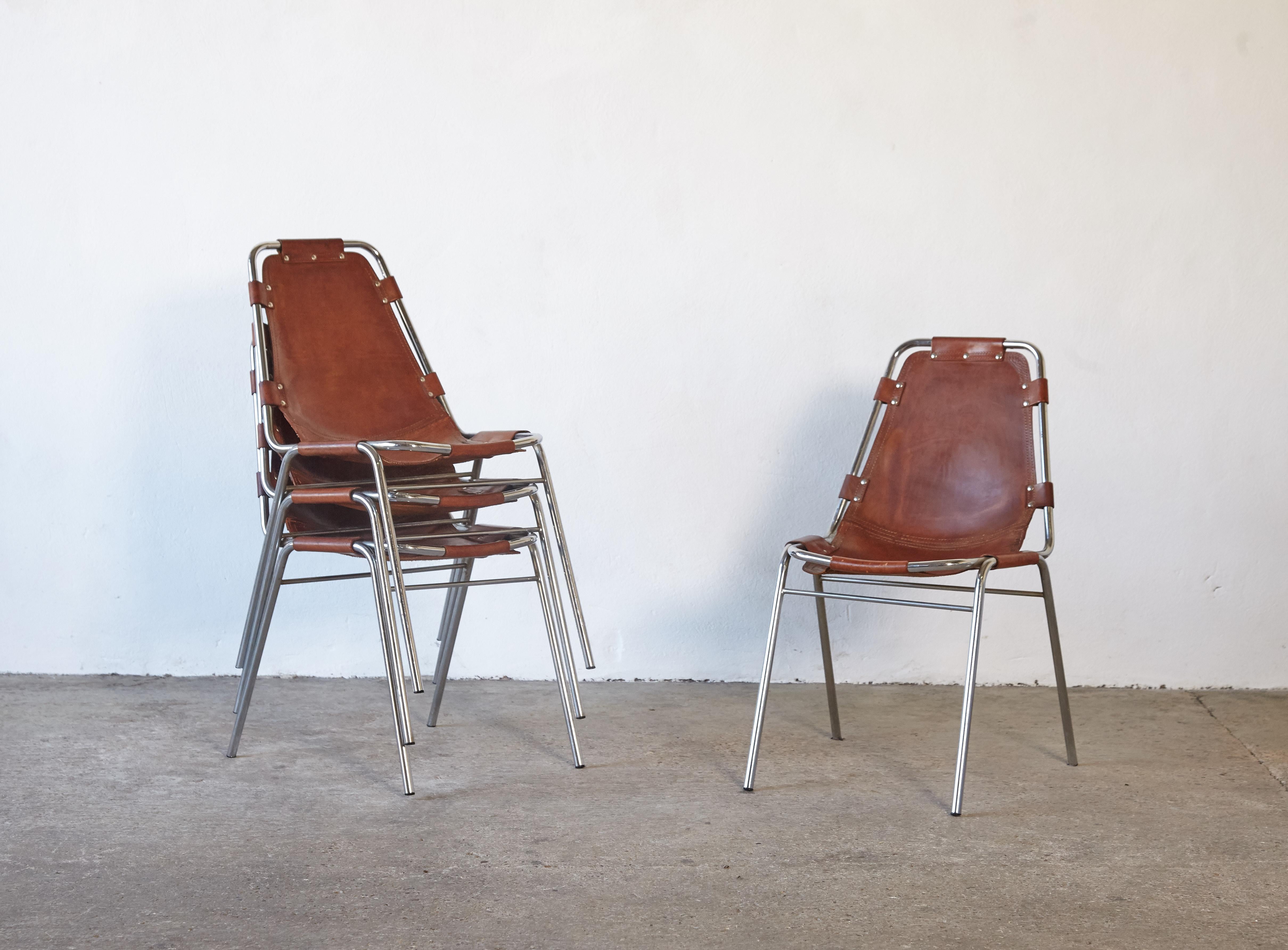 Priced per chair and sold individually - 'Les Arcs' chairs in tubular steel and cognac leather with wonderful patina, France/Italy, 1970s.

Les Arcs was a project on which Charlotte Perriand collaborated with some other architects who developed