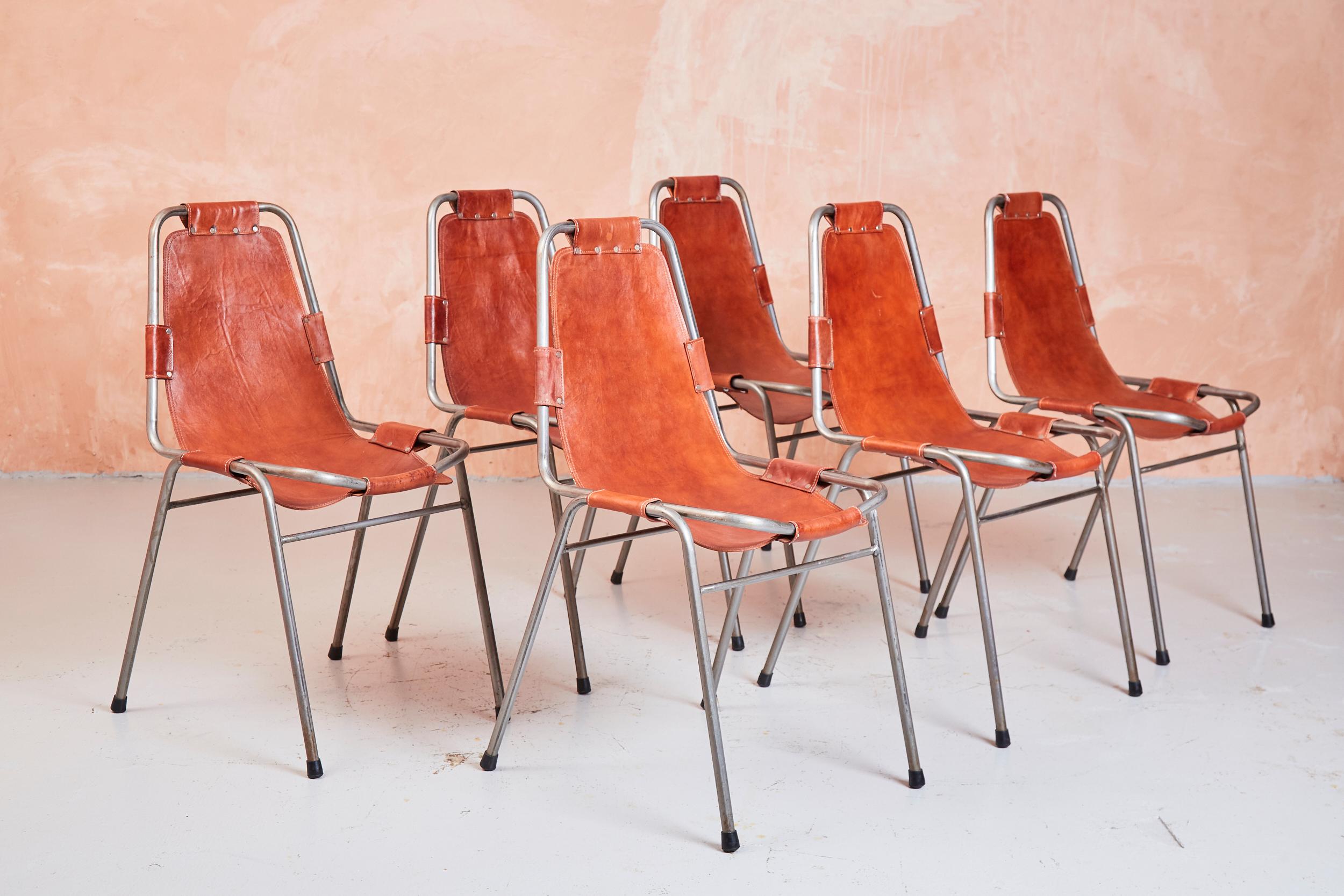 A set of six DalVera chairs, chosen by Charlotte Perriand for the Les Arc ski resort

Two of the set have torn between the seat pad and the suspension strap, the set has been priced accordingly.

These design classics are cited in many