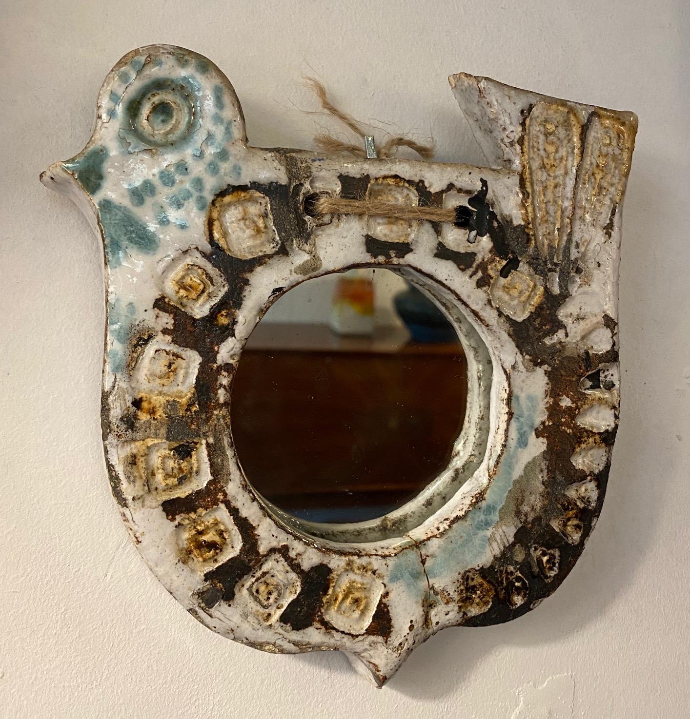 Ceramic mirror, France, Vallauris, 1960s
Attributed to Les Argonautes (Frédérique Bourguet and Isabelle Ferlay), French workshop created in Vallauris, south of France, in 1953 and active until the death of Federique Bourguet in 1997.
