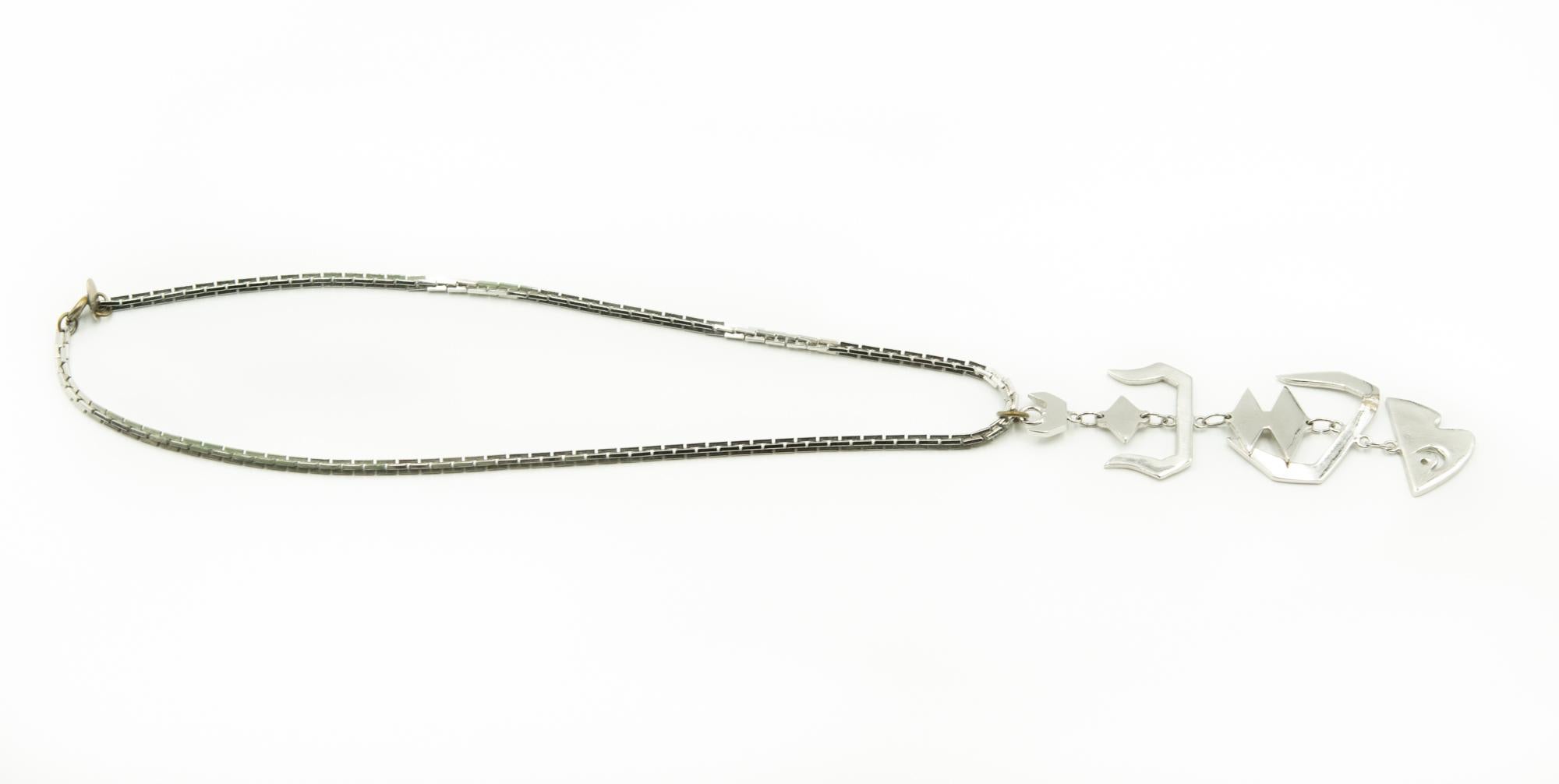 Les Bernard Dangling Fish Pendant Necklace Silver Toned Metal In Fair Condition For Sale In Miami Beach, FL