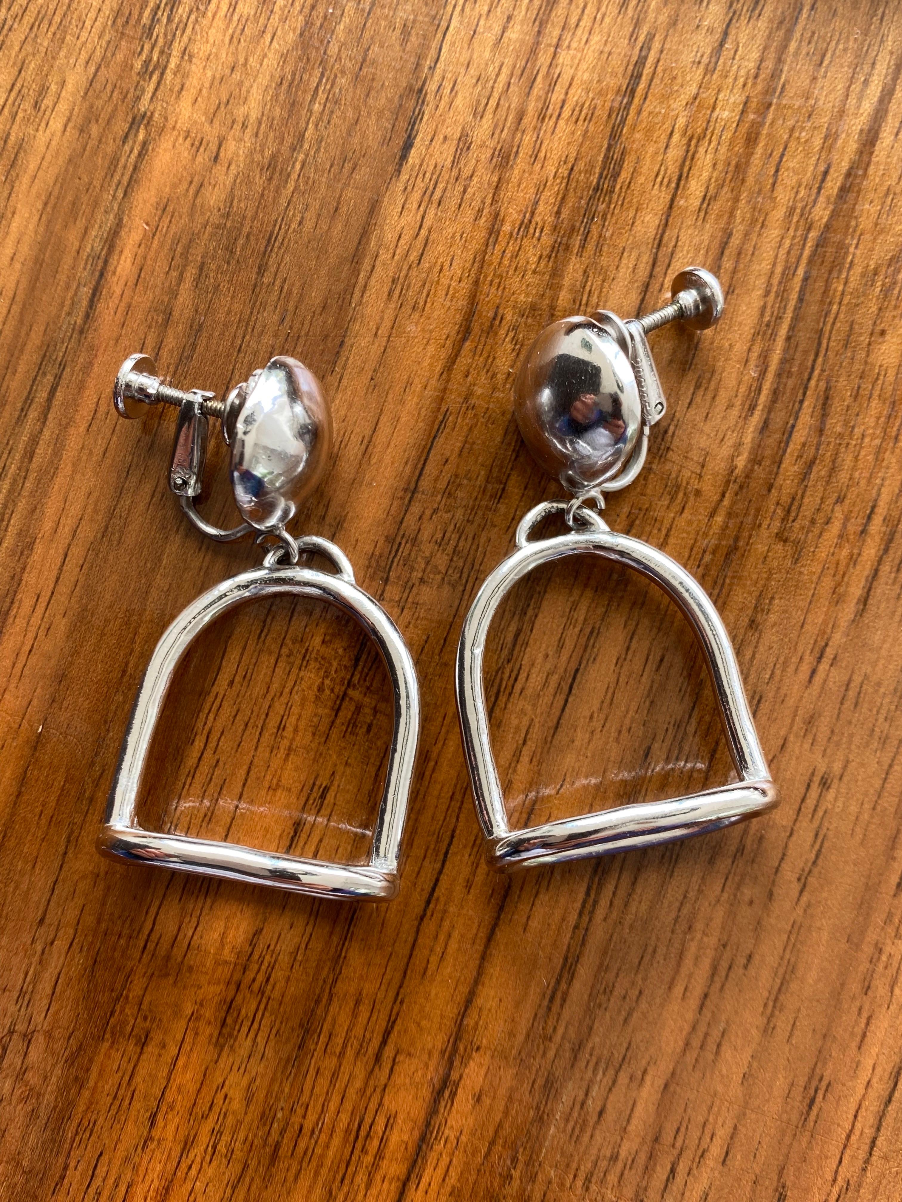 Supercool stirrup earrings from Les Bernard, the legendary 1980s Dynasty costume jeweller to the stars
Crafted in the USA in the 1970s from high quality silver plated metal
Screw back fastening 
3.5 cm drop
The 1970s was all about equestrian style