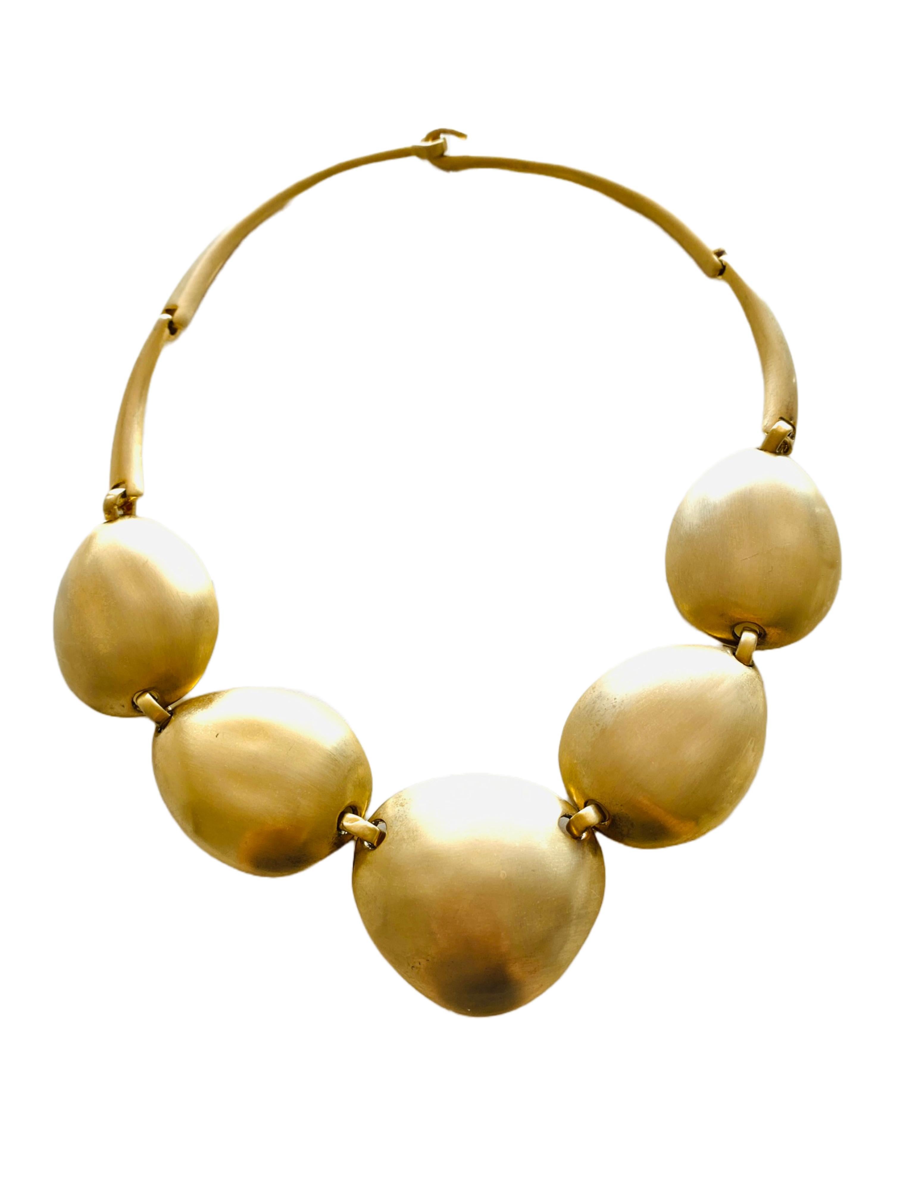 Stylish Les Bernard gold hinged cuff bracelet and necklace set with a pale satin brushed finish.

Bracelet Size: It measures 2.5