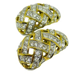 LES BERNARD - Boucles d'oreilles à clip signées et ornées de strass massifs.