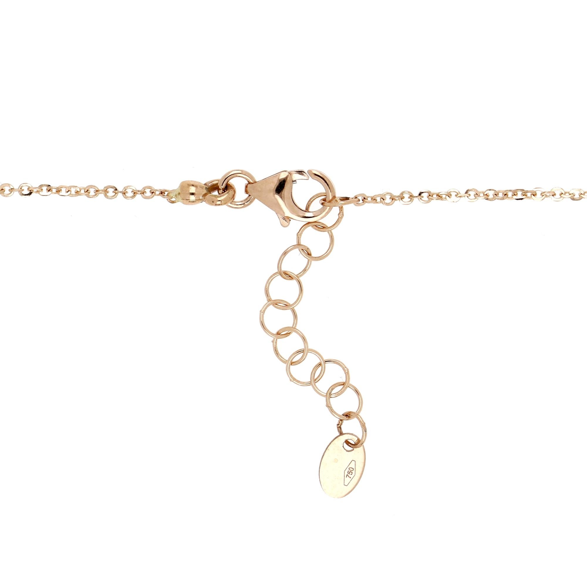 Delicate gold necklace characterized by a pendant with a stone wrapped in a pavè of paraiba that give a touch of freshness to the jewel. The stone seems to blossom like a spring gem. Three diamonds enrich the jewel. 

18 kt rose gold necklace in