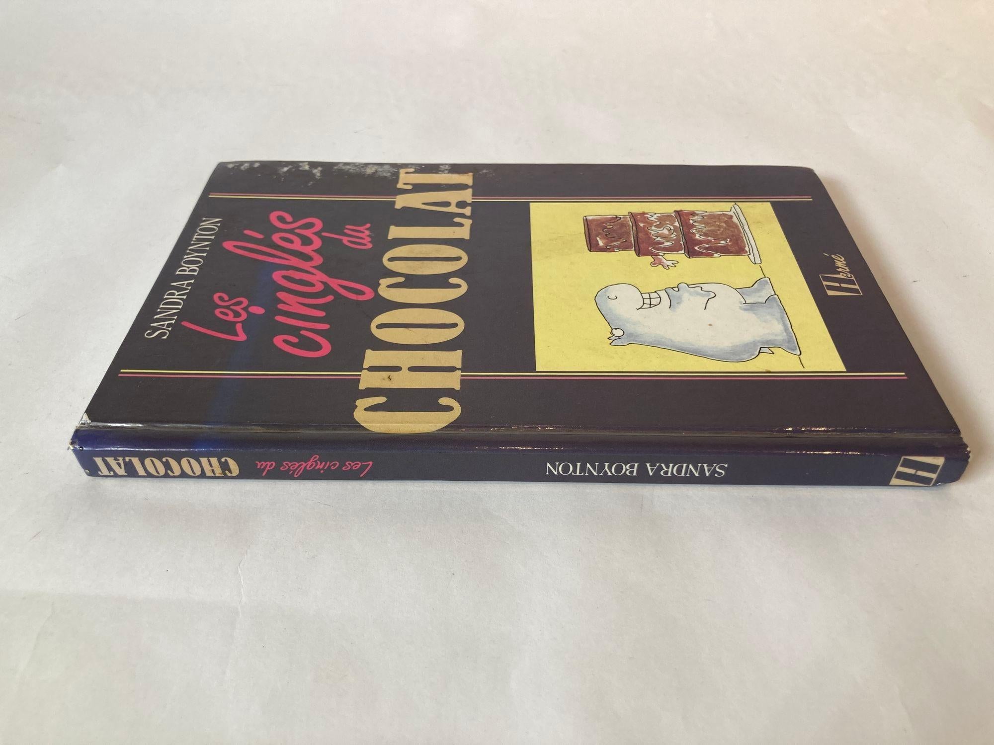 Les cinglés du chocolat Hardcover French Edition.
Text in French small Size.
Dimensions: 8.5 in x 5.5 in x 0.5 in.
Les cinglés du chocolat by Sandra Boynton, Jean-Jacques Brisebarre, Sylvie Girard.
Published: 1987.
English title: Chocolate: The