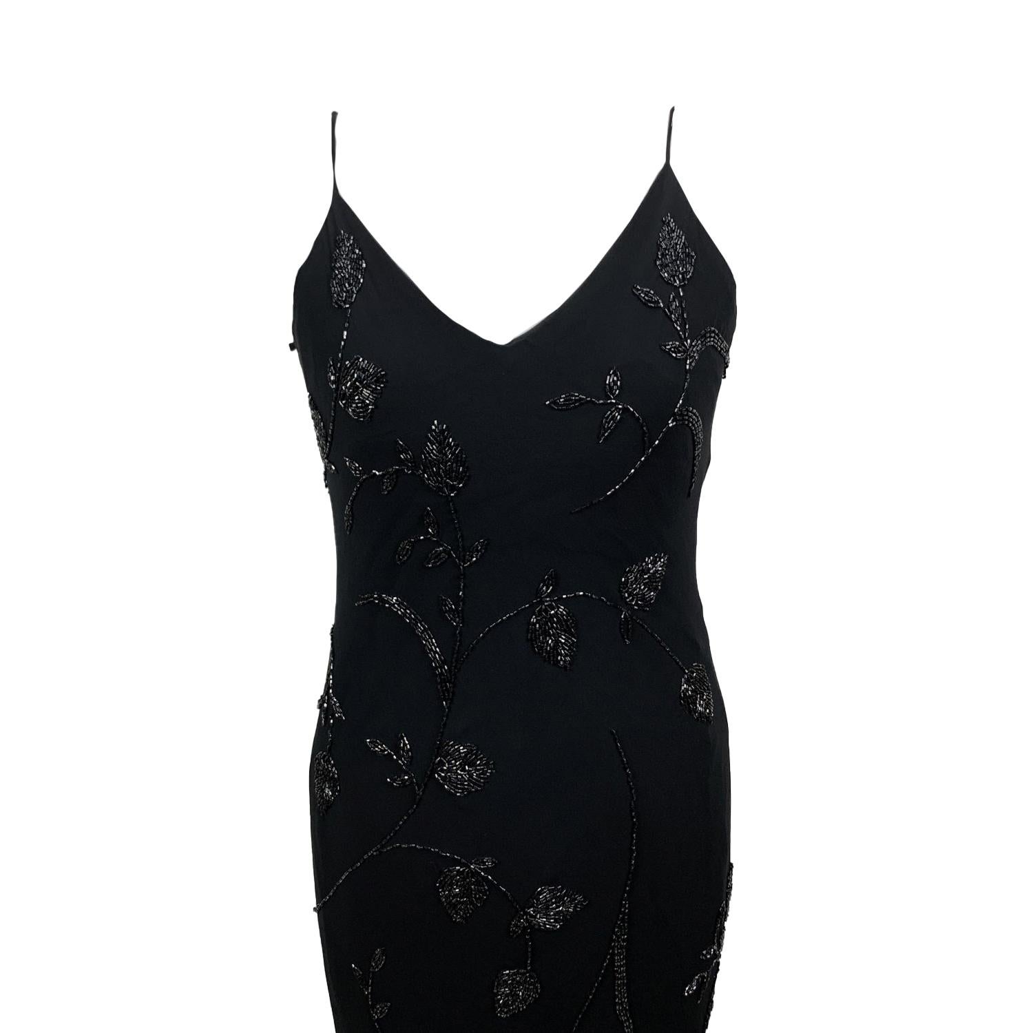 Gorgeous full length chiffon gown in black color, by Les Copains. Beautiful floral beading. It features spaghetti straps and a scoop neckline and back. Rear zip closure with hook and eye. Size: 48 IT (it should correspond to a Large