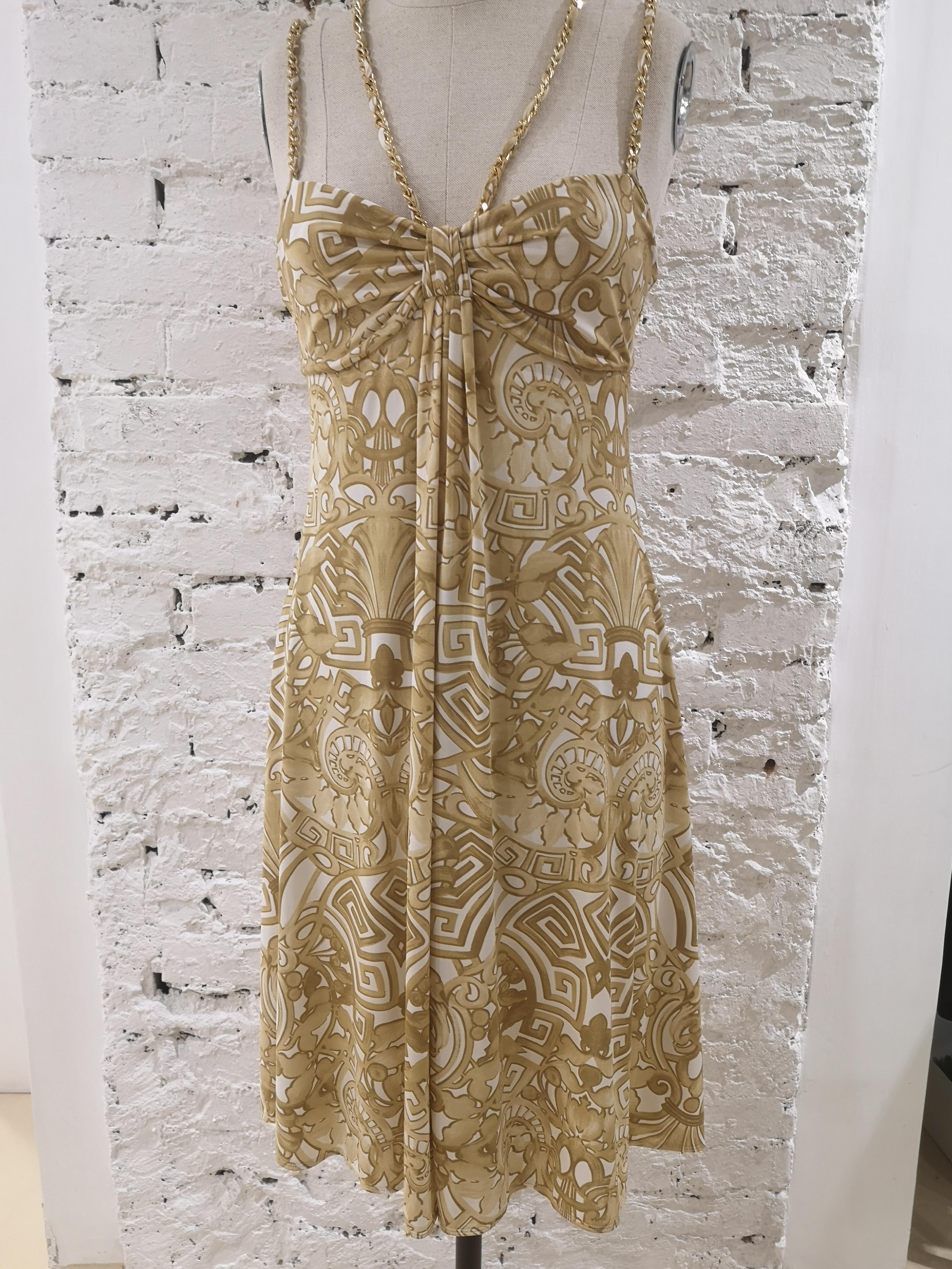 Les Copains Dress
Nude tone, chain on shoulder and around the neck dress totally made in italy in size 44