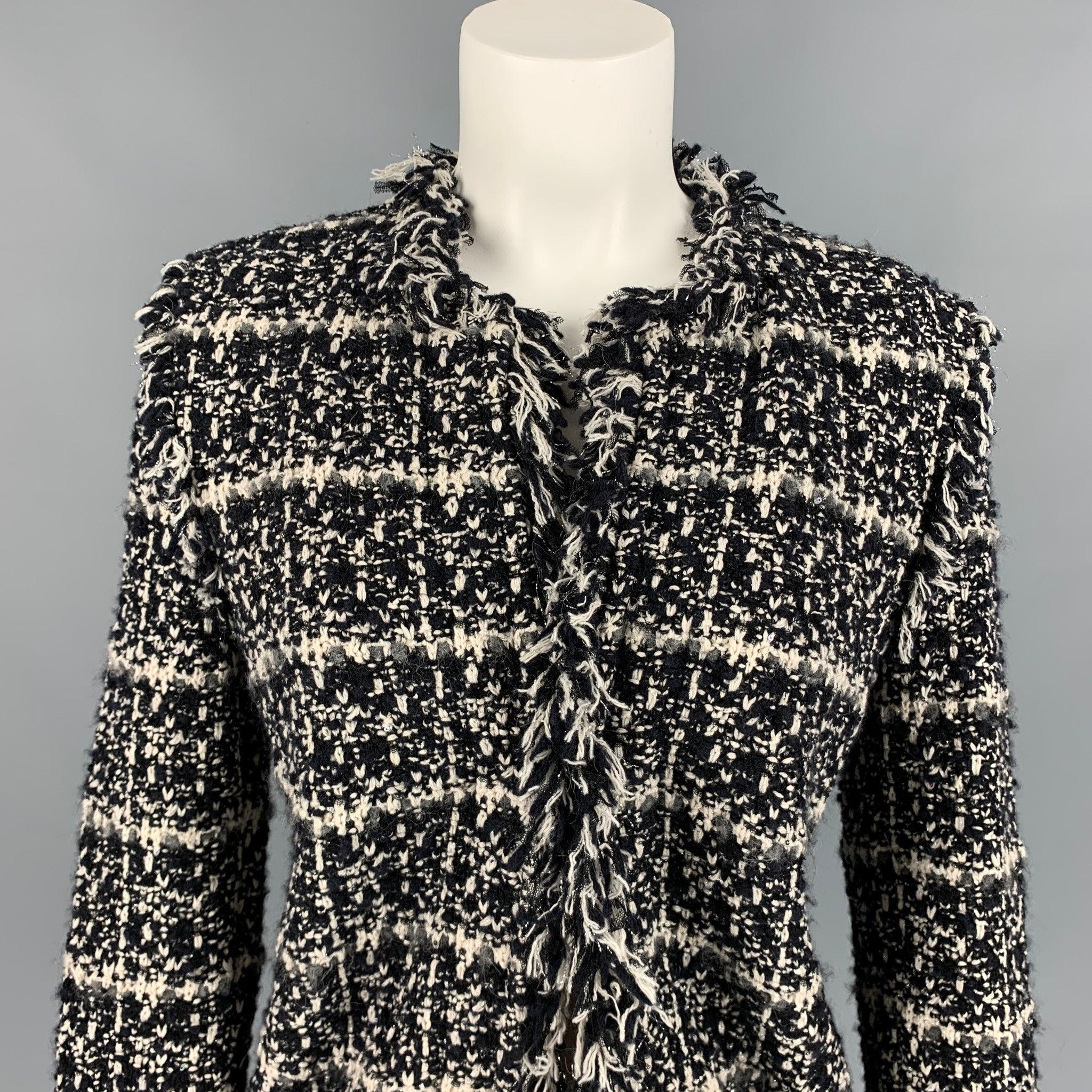 LES COPAINS jacket comes in a black & white boucle cotton blend featuring a fringe trim and a hook & loop closure.
Very Good
Pre-Owned Condition. 

Marked:   42 

Measurements: 
 
Shoulder: 16 inches  Bust: 34 inches  Sleeve: 25 inches  Length: 21