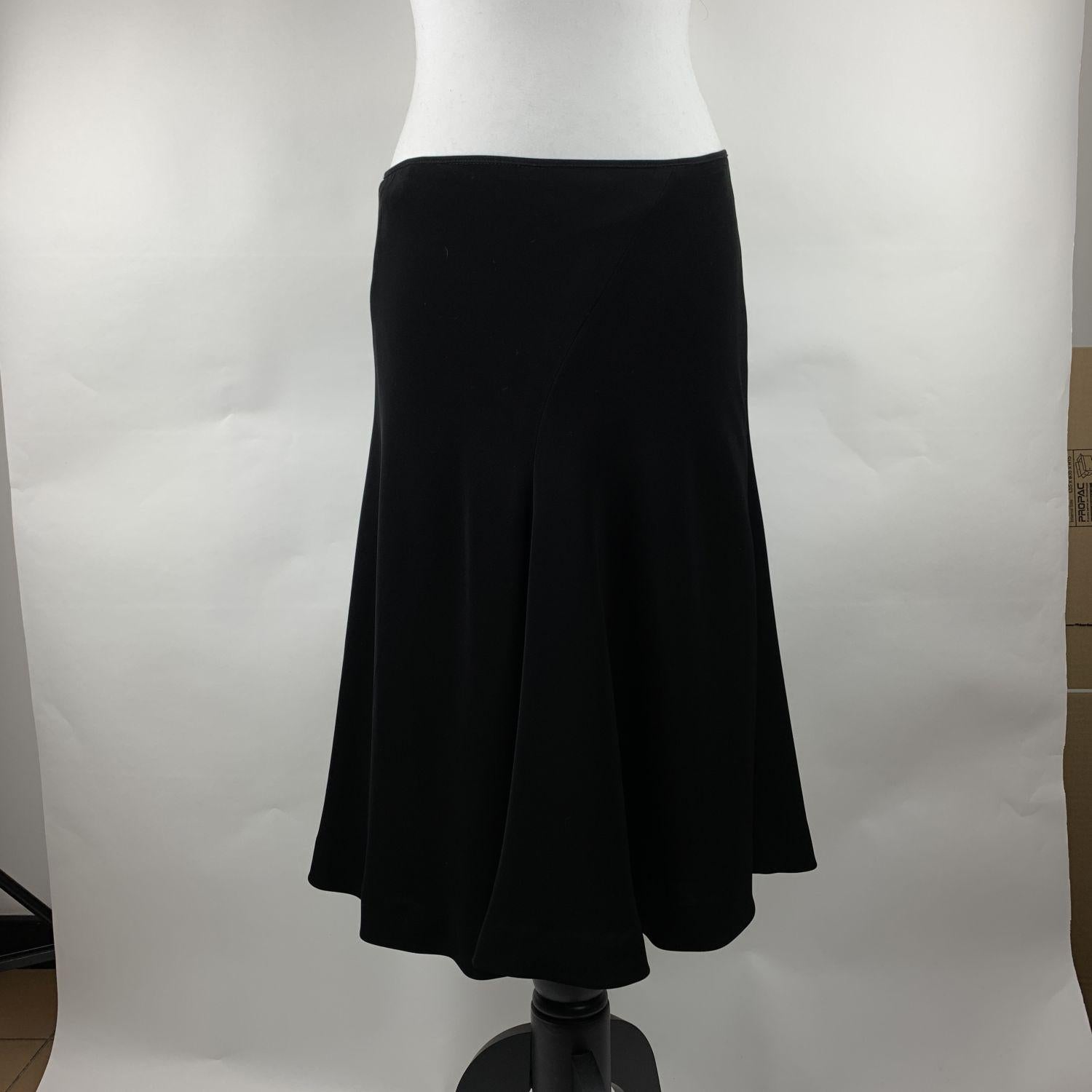 Les Copains black flared skirt. Zip closure. Composition: 100% Polyethilene. Size : 44 IT (The size shown for this item is the size indicated by the designer on the label). It should correspond to a MEDIUM size.

Details

MATERIAL: Rayon

COLOR: