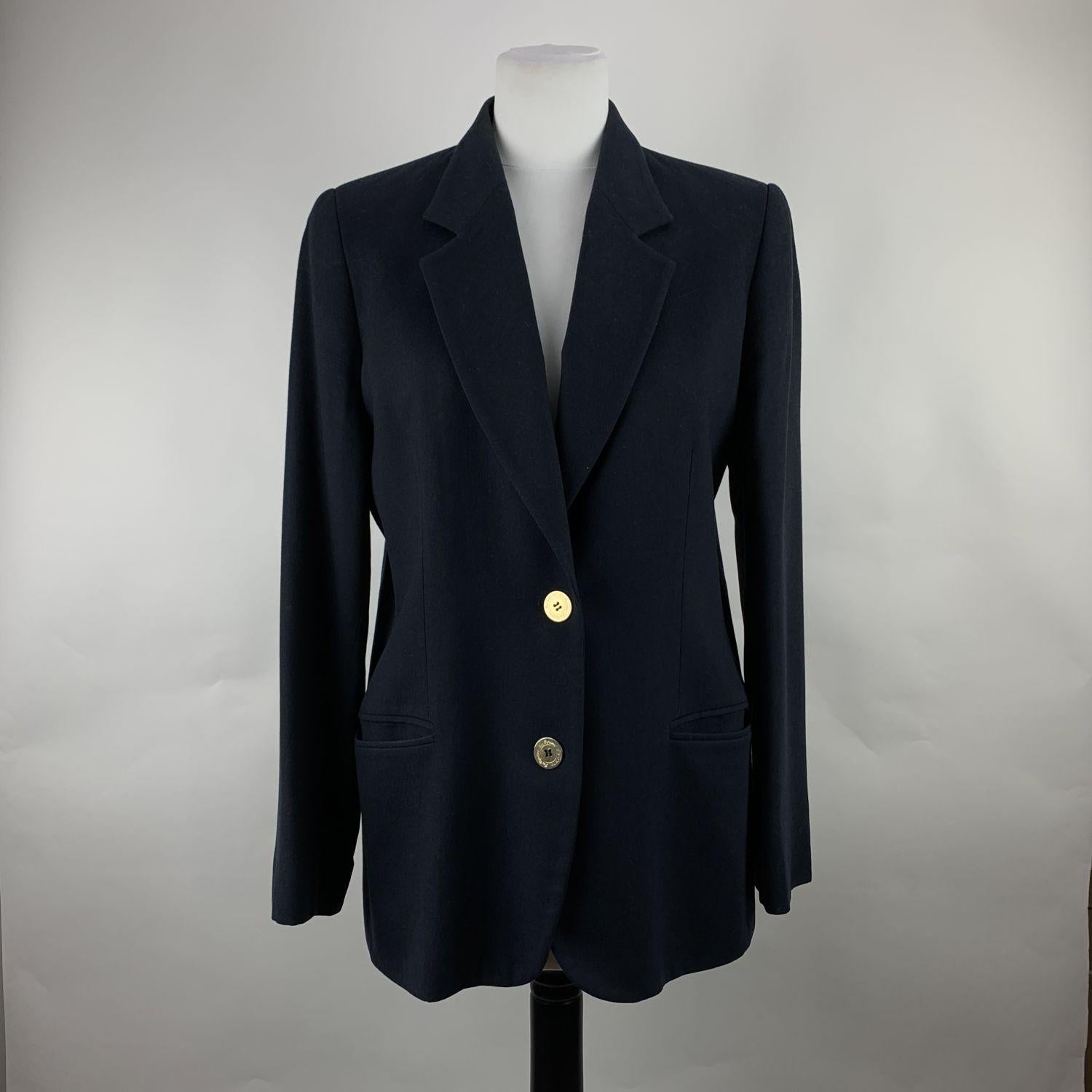 Vintage cupro blazer in navy blue color by LES COPAINS. Long sleeve styling with buttoned cuffs. It features lapel collar, front button closure, 2 front fpockets. Lined. Composition: 100% cupro. Size: 42 IT (The size shown for this item is the size