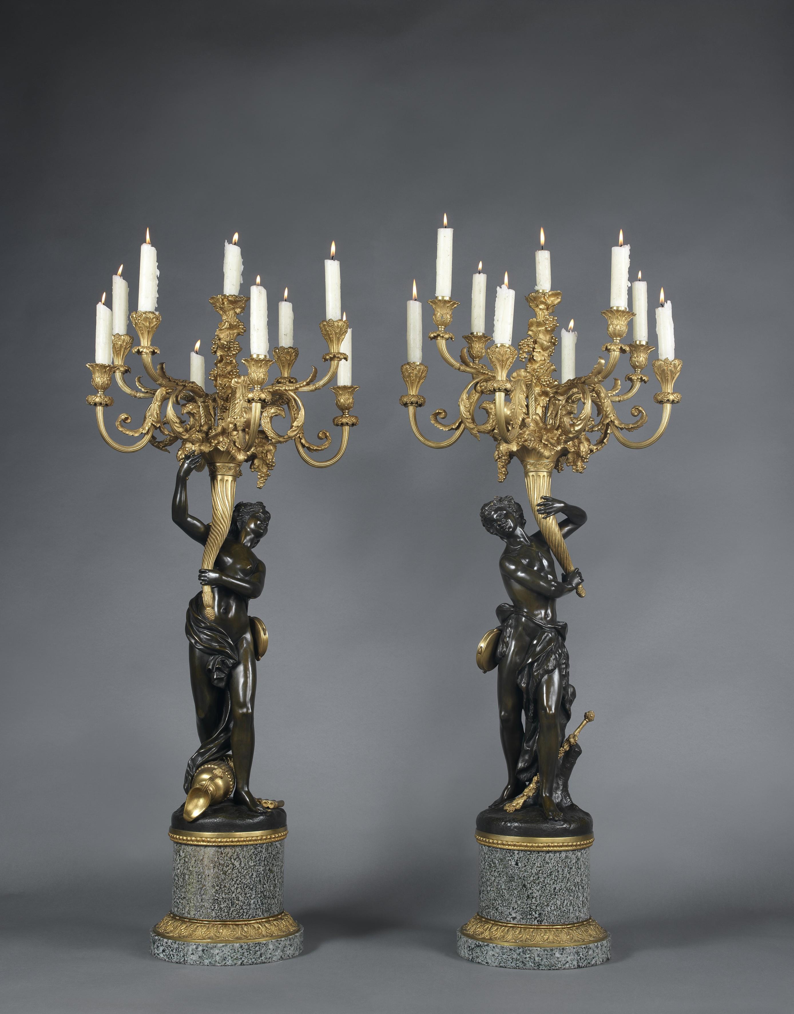 ‘Les Grands Faunes’, a large and very finely cast pair of gilt bronze and patinated bronze figural candelabra on green granite marble bases, after a model by François Rémond.

French, circa 1880.

The candelabra are in the form of a patinated