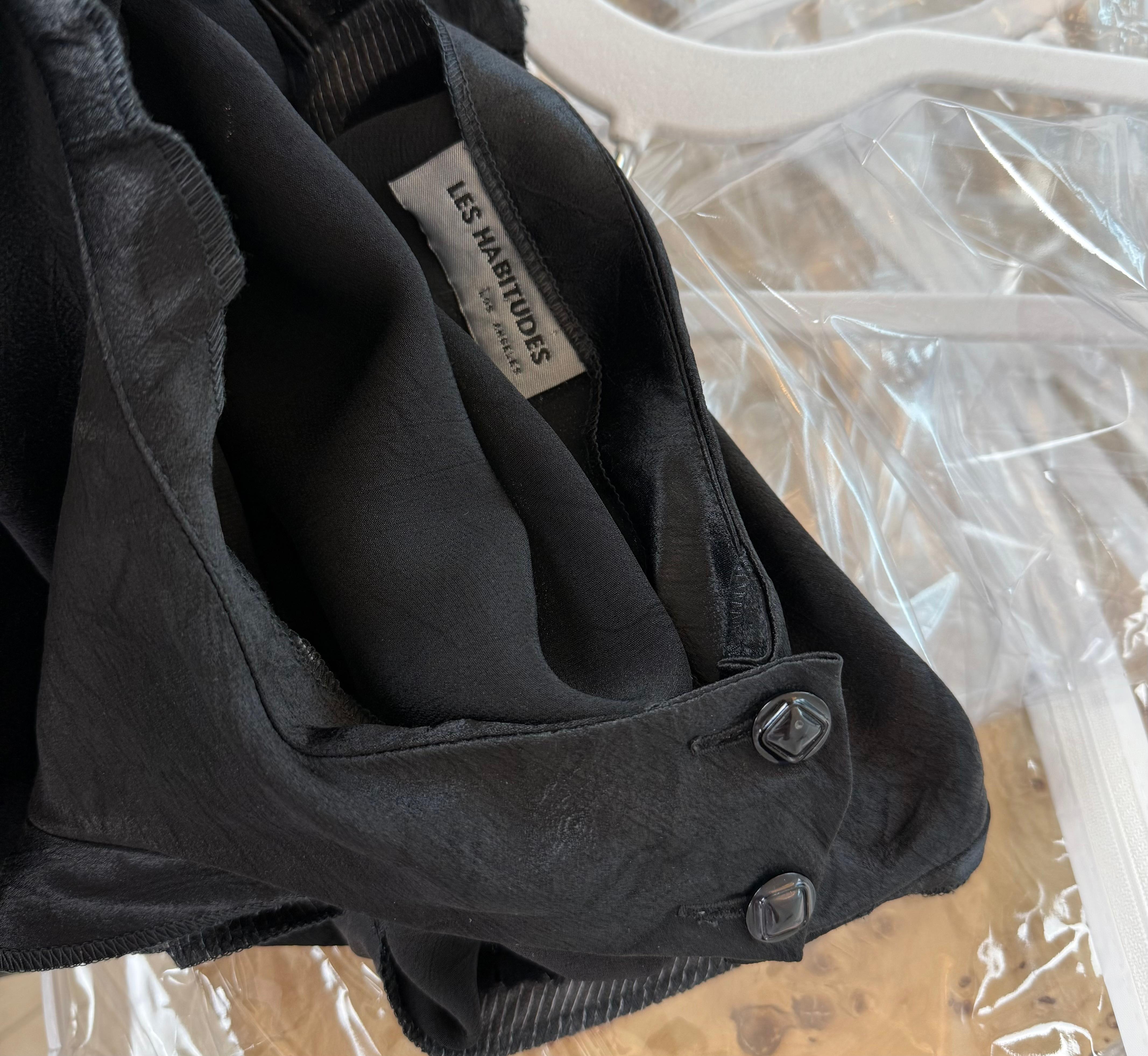 Les Habitudes
Jet black opaque
Crinkle effect but chic
Has panels so I lightened pics so you can see them
Has an attached ribbon that you can tie however you like
2 buttons on left shoulder
No size tag, fits many sizes, see measurements below
No