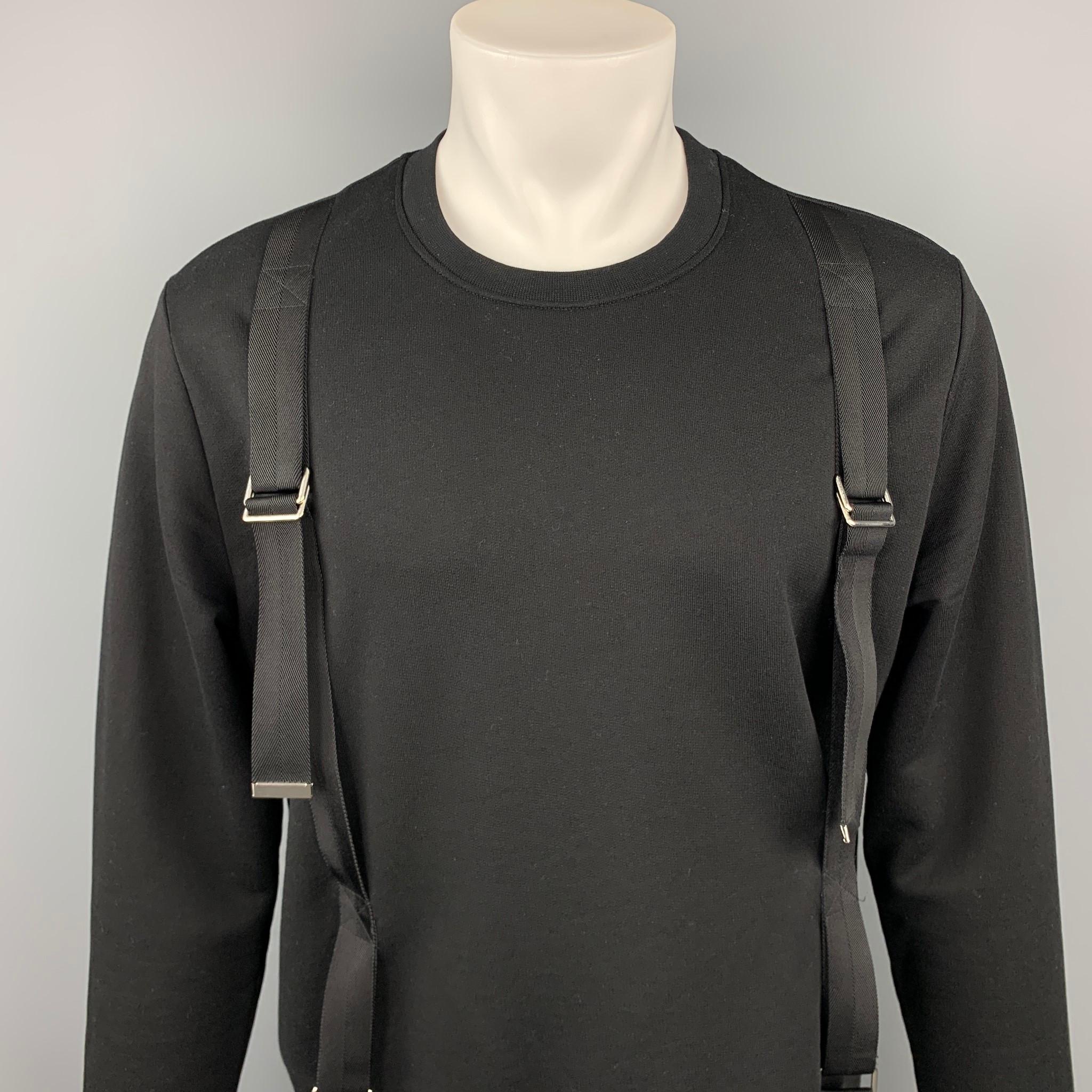 LES HOMMES sweatshirt comes in a black cotton with bondage strap details featuring a crew-neck.

Excellent Pre-Owned Condition.
Marked: M

Measurements:

Shoulder: 20 in. 
Chest: 46 in. 
Sleeve: 27 in. 
Length: 26.5 in. 