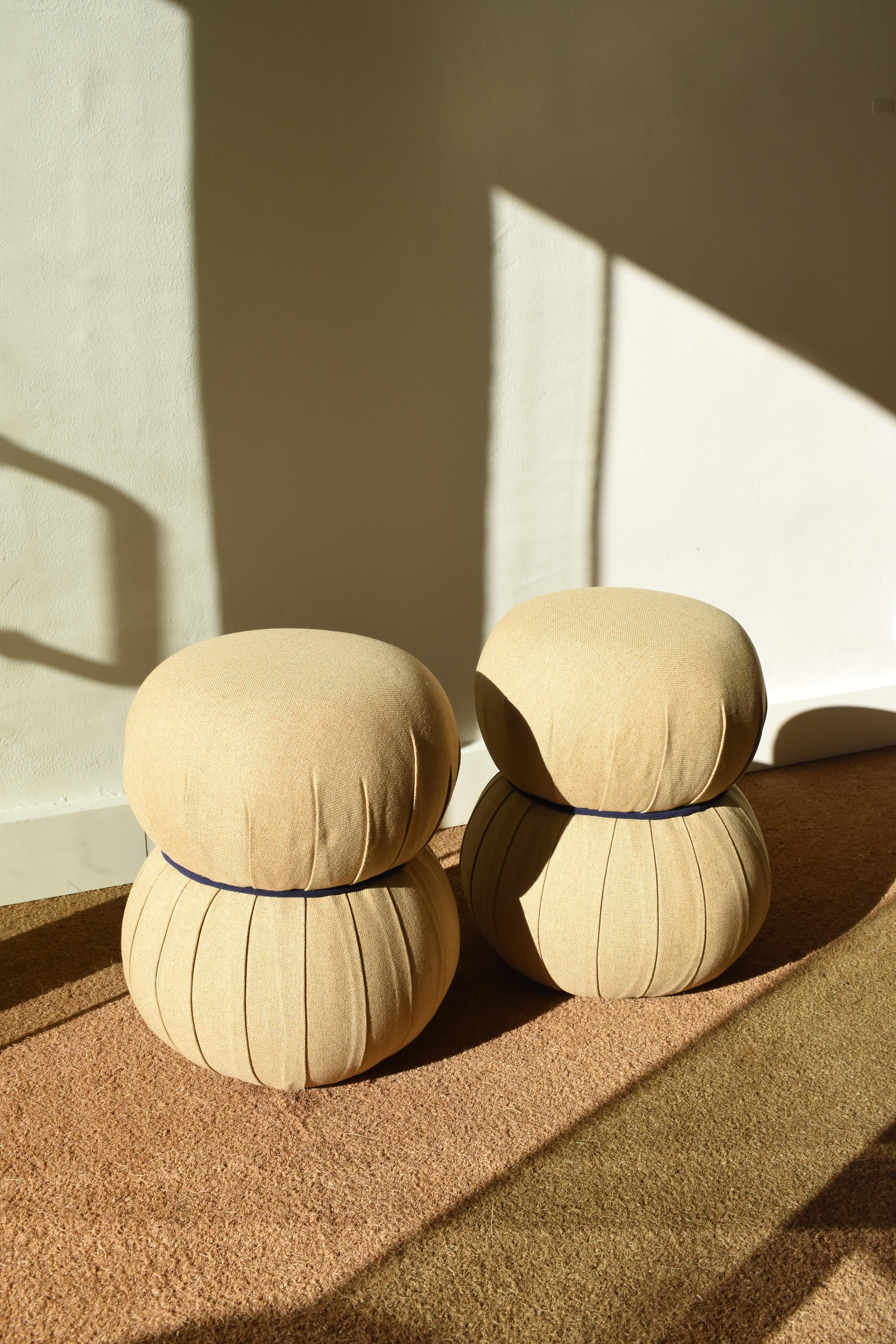 Beautiful pouffs from the 1990's coming from a Spanish private collection in Seville. They have been reupholstered and they're in perfect condition Ideal for any space where you need a very light extra seating and a modern and elegant decorative