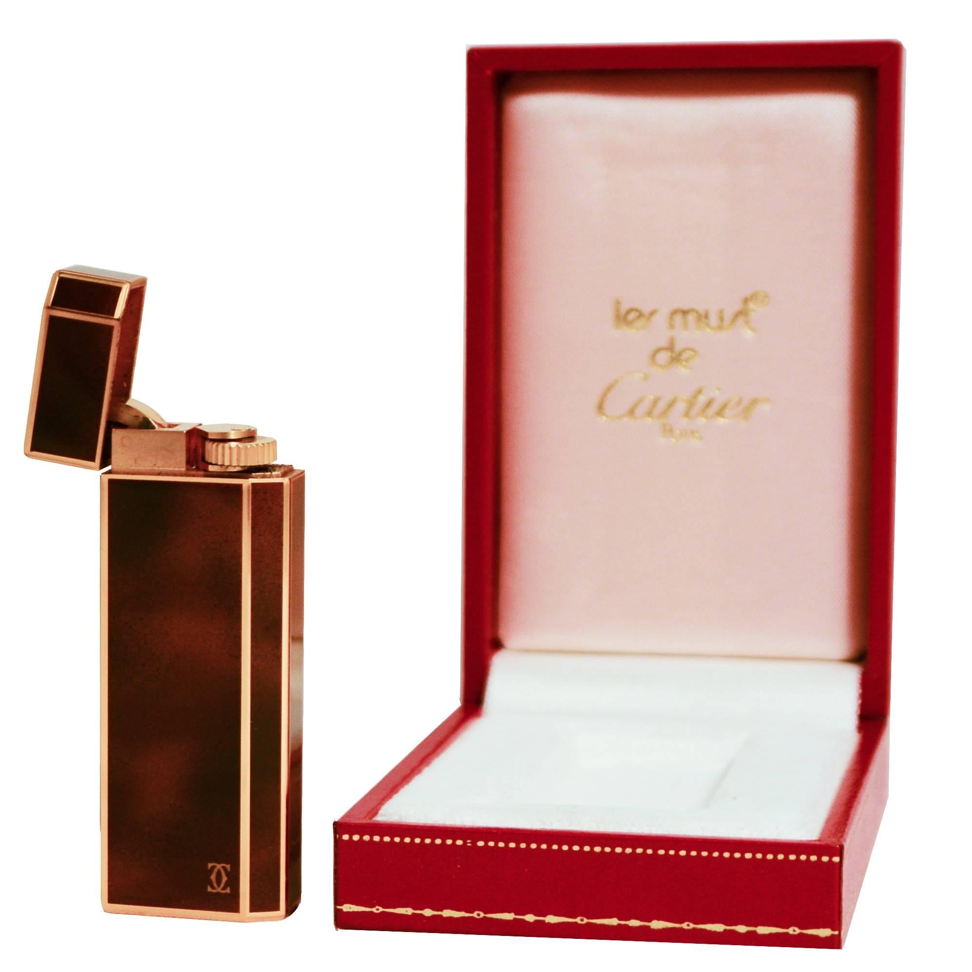 The lighter is brown with golden details 

Made in France 
Measures: 2.5 L x 7 H x 1 W cm.