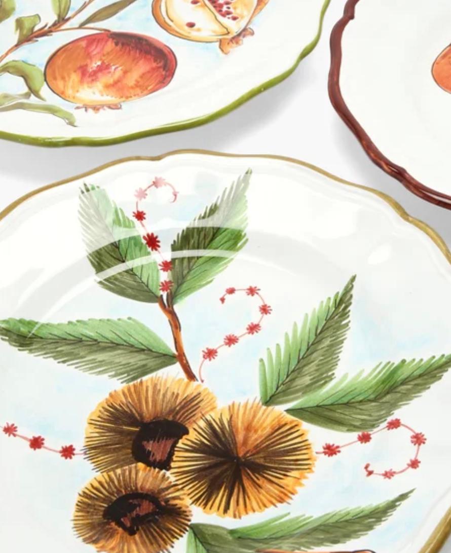 Les Ottomans Le Bois ceramic plates set of 4, hand-painted, Scallop-edged, Italy. Les Ottomans's set of four Le Bois plates are expertly hand-illustrated with vivid pomegranate, kiwi, mushroom and pear motifs. They're made in Italy from glazed