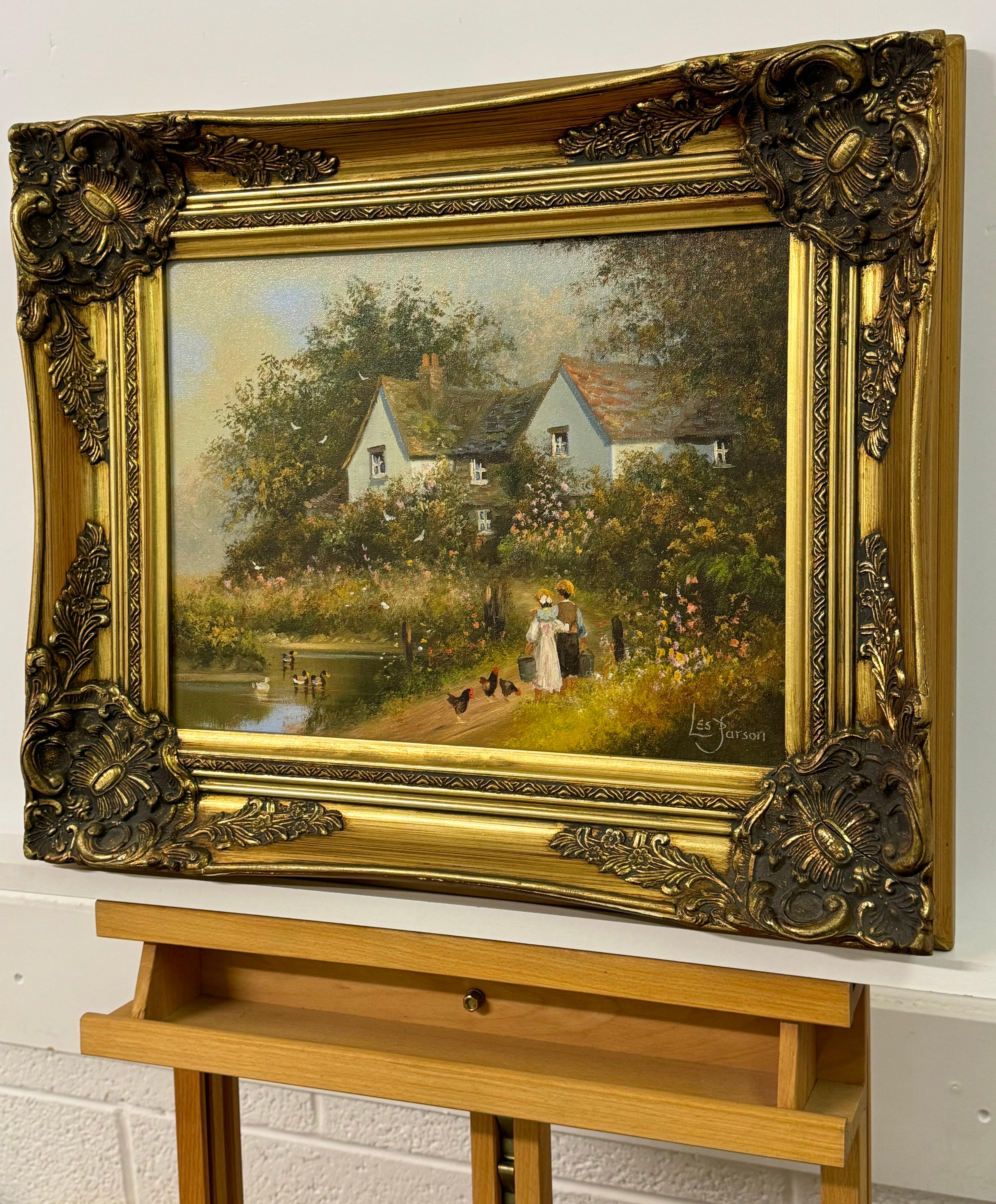 Children holding pails with chickens by a duck pond & cottage in Rural England For Sale 1