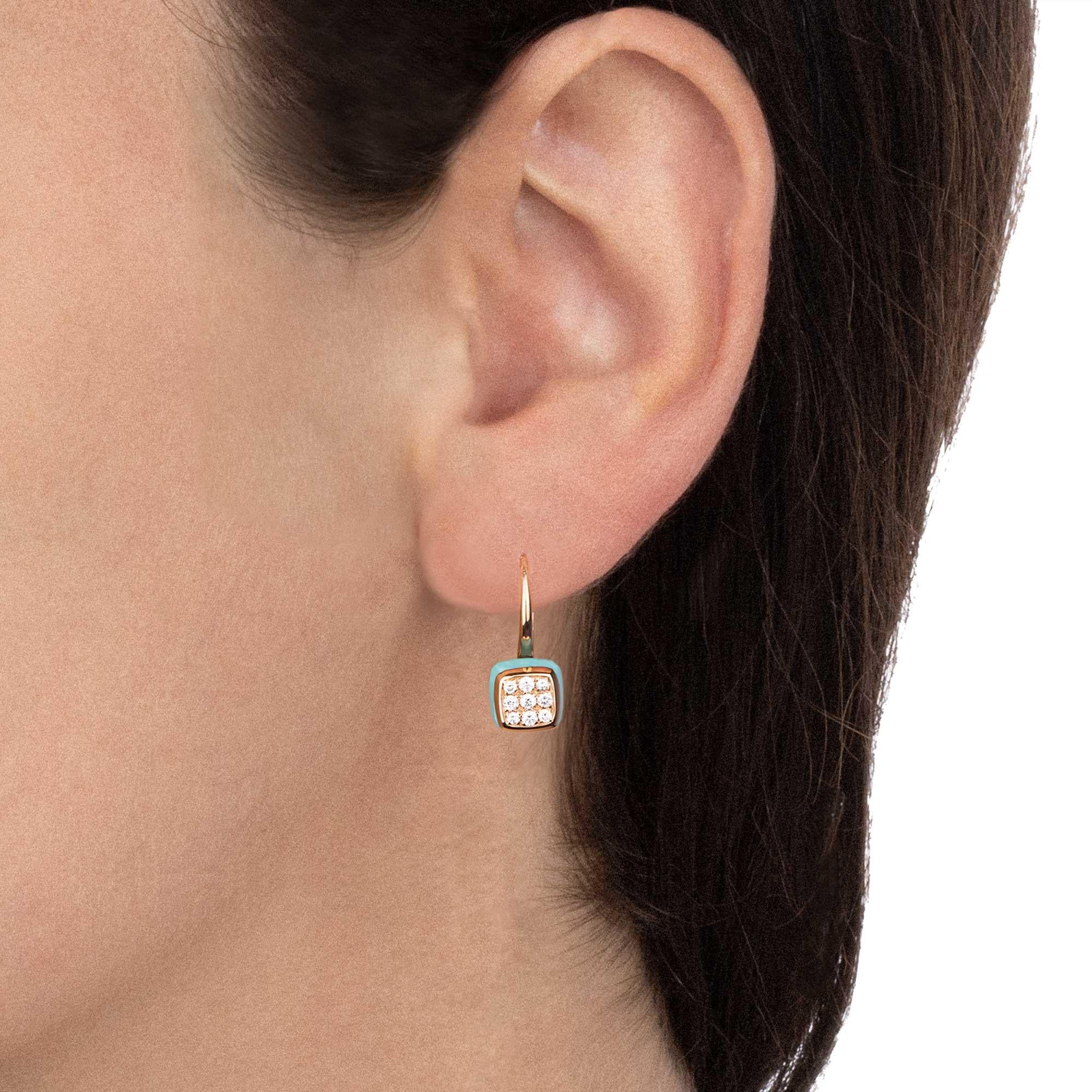 Light blue like a summer sky, the turquoise of these earrings enhances the diamonds like dewdrops on top of it. A refreshing colors harmony for a lively design.

Cast polish rose gold earrings, cushion cut turquoise 5.30 ct and diamonds pavé of 0.40