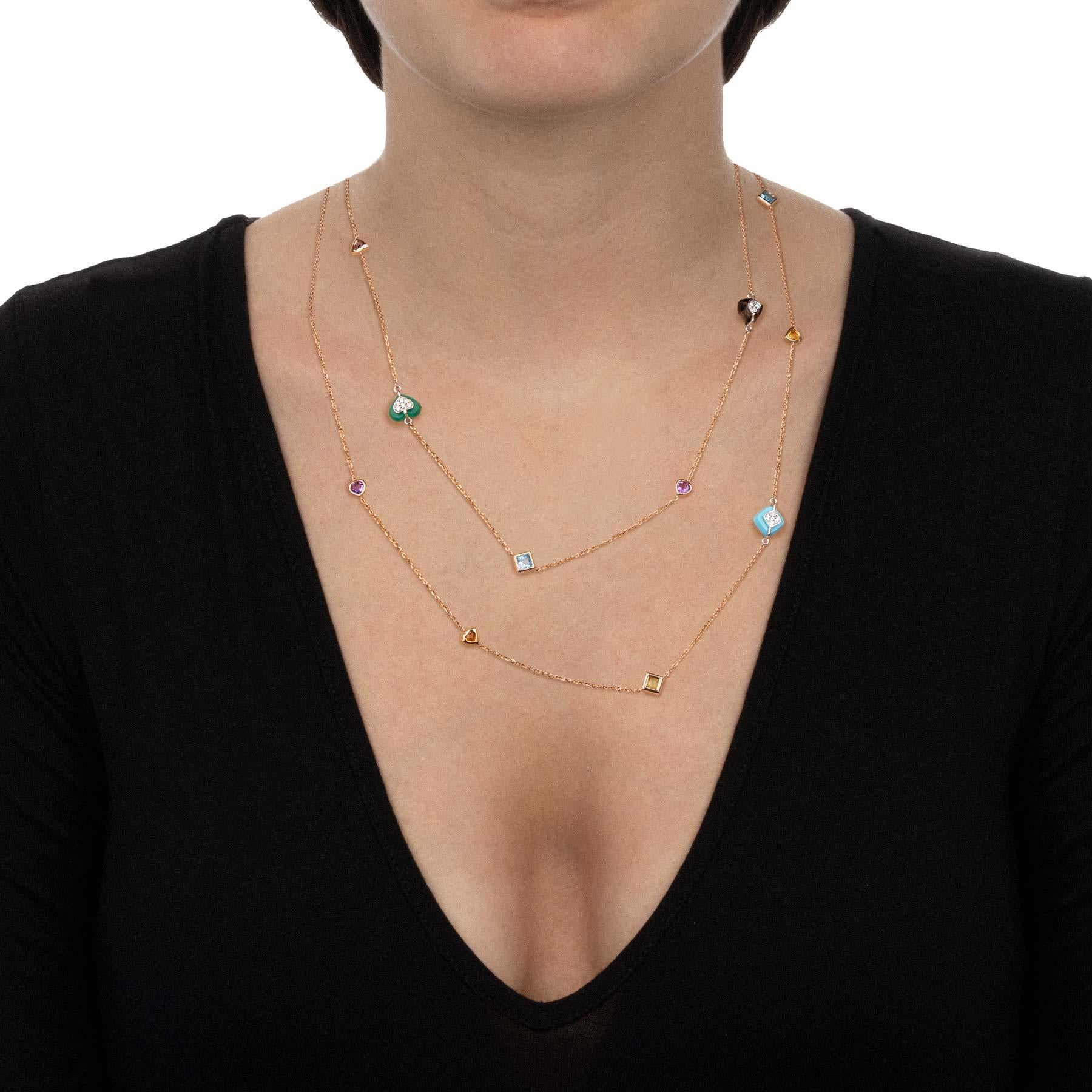 This long necklace of a thousand colours' shades is embellished with precious stones and sparkling diamonds. The rose gold chain gives a touch of refinement and elegance for a timeless classic with a fresh and fun allure.

110 cm lenght necklace,