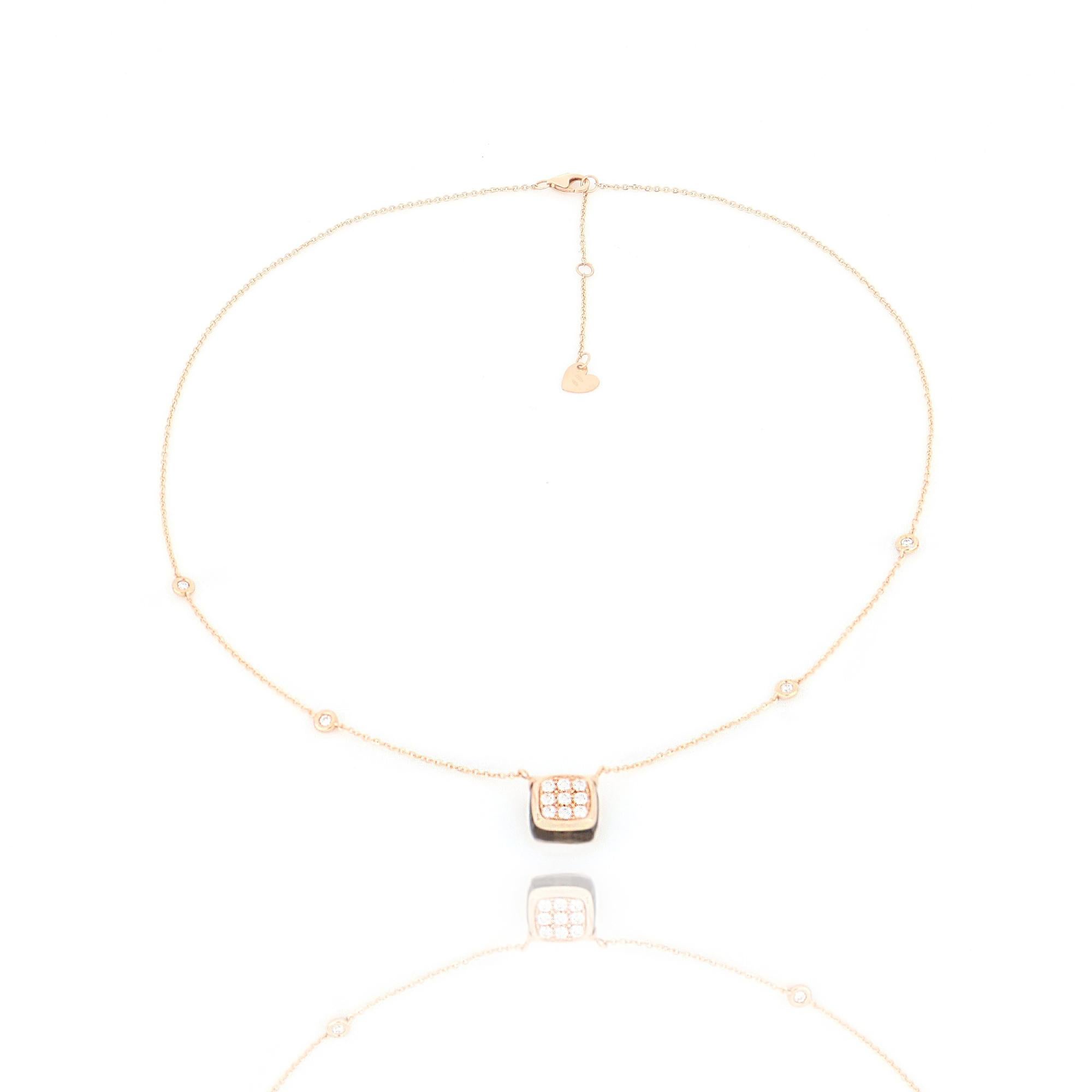A smoky quartz candy make the base for the diamonds on its top. Notes of light and amber for a playful and never boring design.

Necklace length 43 cm with extension at 45 cm and 48 cm, rose gold diamond chain, cushion cut smoky quartz 5.10 ct with