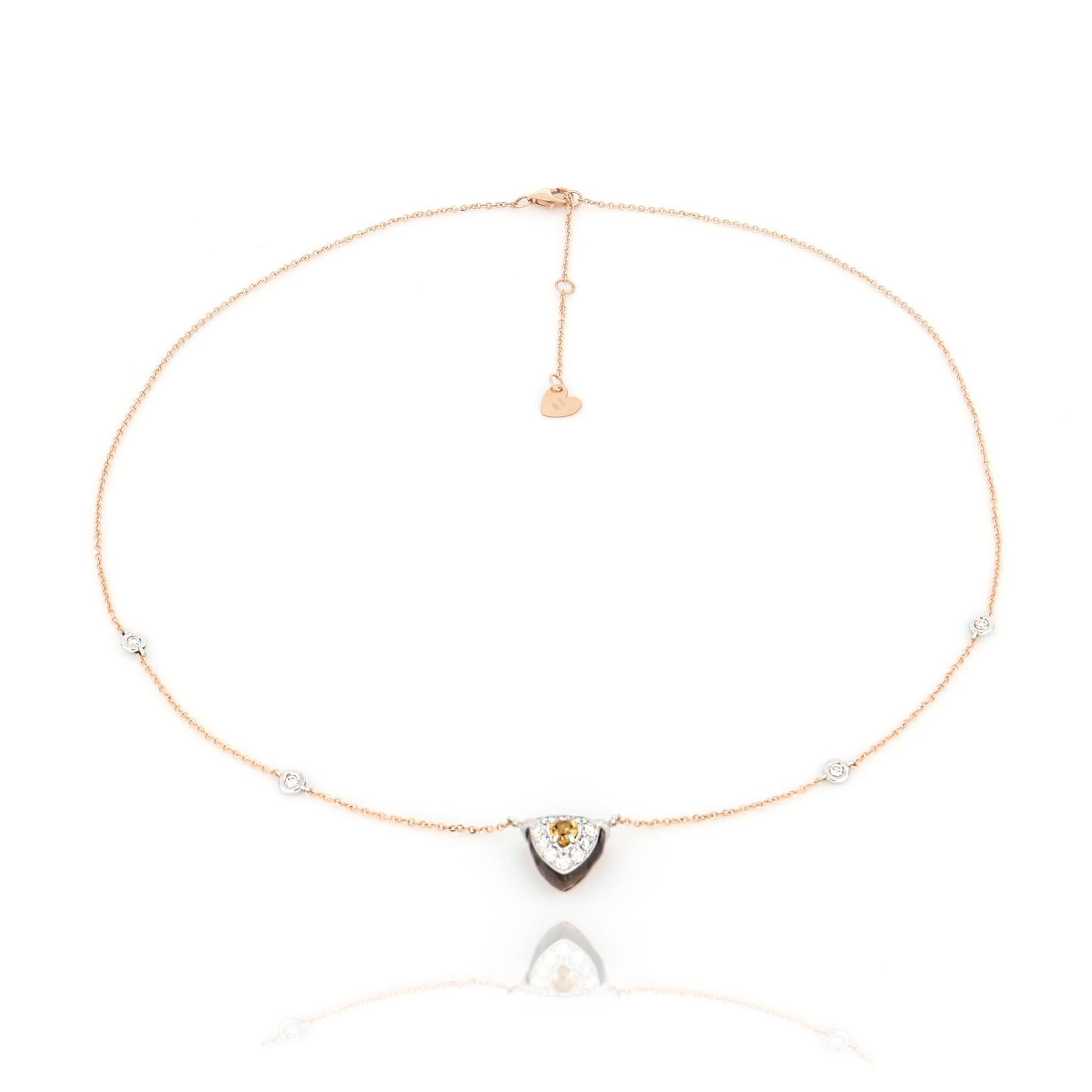 A golden citrine, a brown quartz with elegant transparency and a diamonds pavé are the focus on the center of this rose gold necklace. A poetic symphony of elegance for a unique style.

Necklace lenght 43 cm with extension at 45 cm and 48 cm, rose