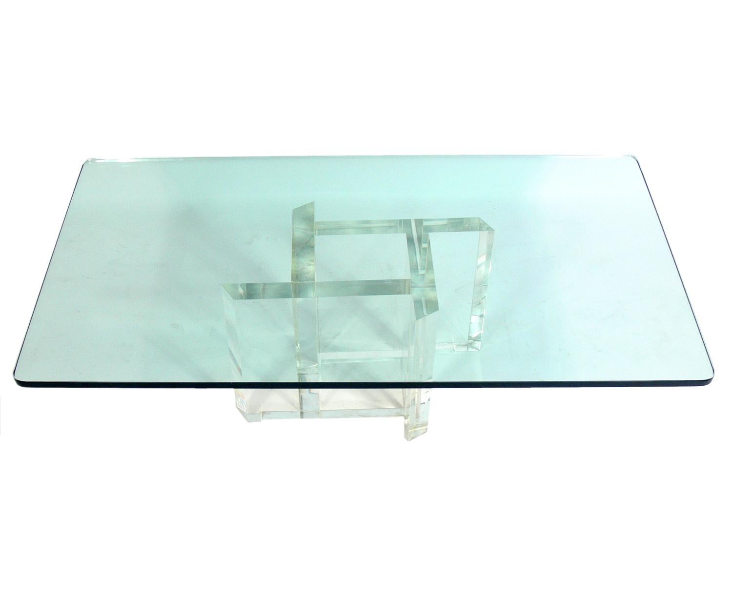 Les Prismatiques Lucite and glass coffee table, American, circa 1970s. Signed Les Prismatiques on base. It is well constructed with a chunky Lucite or acrylic base and a thick rectangular glass top.
  