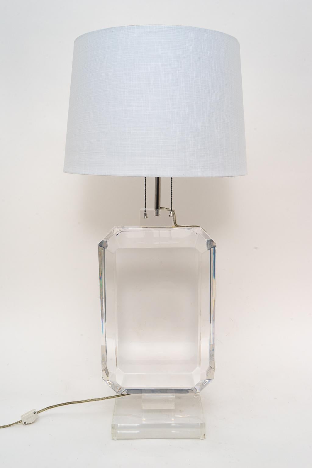 Stunning stylized beveled Lucite table lamp. 

Lamp size is 10 x 6 x 32