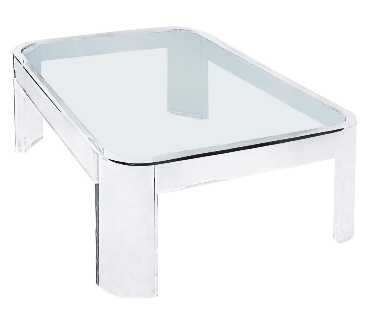 Made in the 1970s, this coffee table was produced by Les Prismatiques, who focused primarily on lucite and glass in their products. Made of thick sheets of clear lucite and glass, this coffee table is very stable and sturdy, and for its age, it has