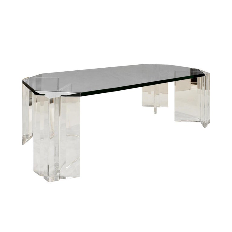 Coffee table with 4 sculptural Lucite legs and thick glass top by Les Prismatiques, American 1970s (signed on each leg 