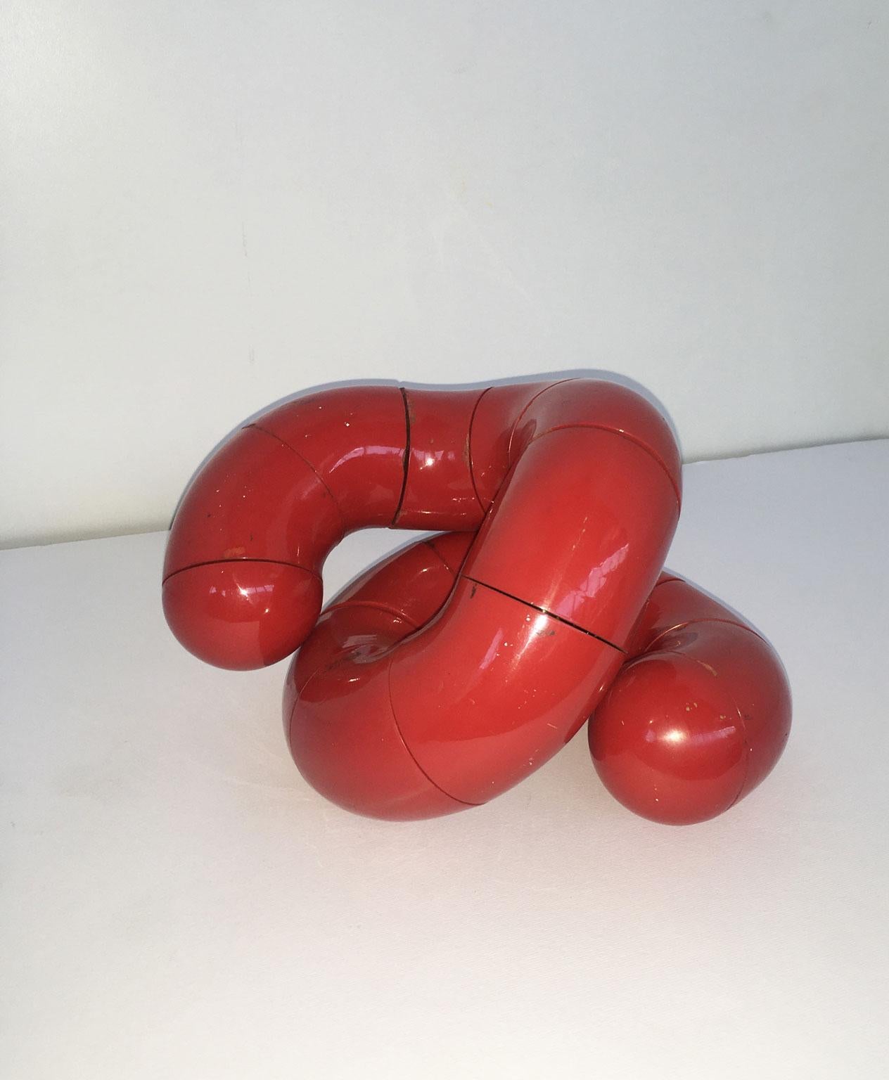 This engaging and kinetic artwork was created by the French artist Jean Marie and Marthe Simonnet Title "Polimorphes" translated in  "Polymorphic". 
This artwork is Kinetic and can change its form in numerous way. It is full of joy of life.
The