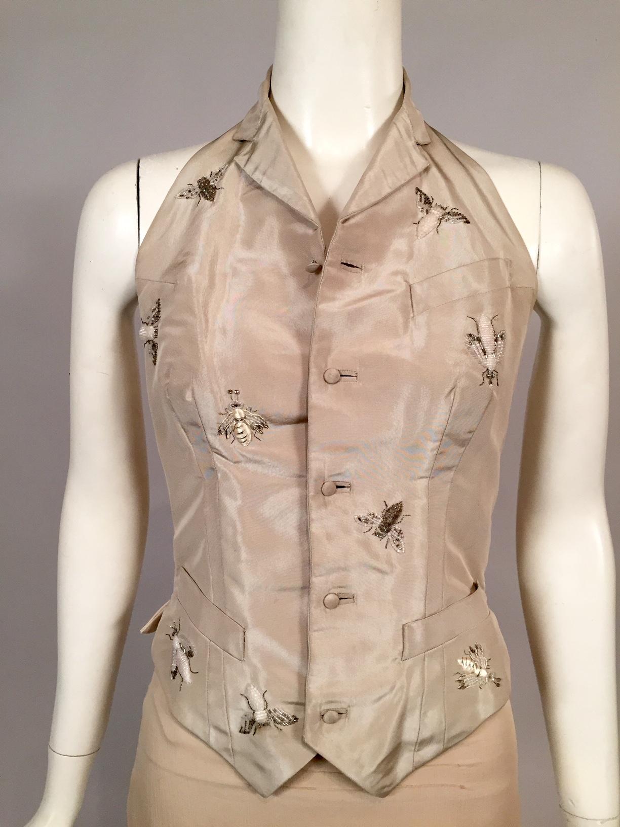 The Lesage Paris atelier used silver and white beads and cream silk and silver metallic threads to create the honey bees on this silk taffeta vest from Maggie Norris Couture. Documentation can be found on the designers website and Instagram account.