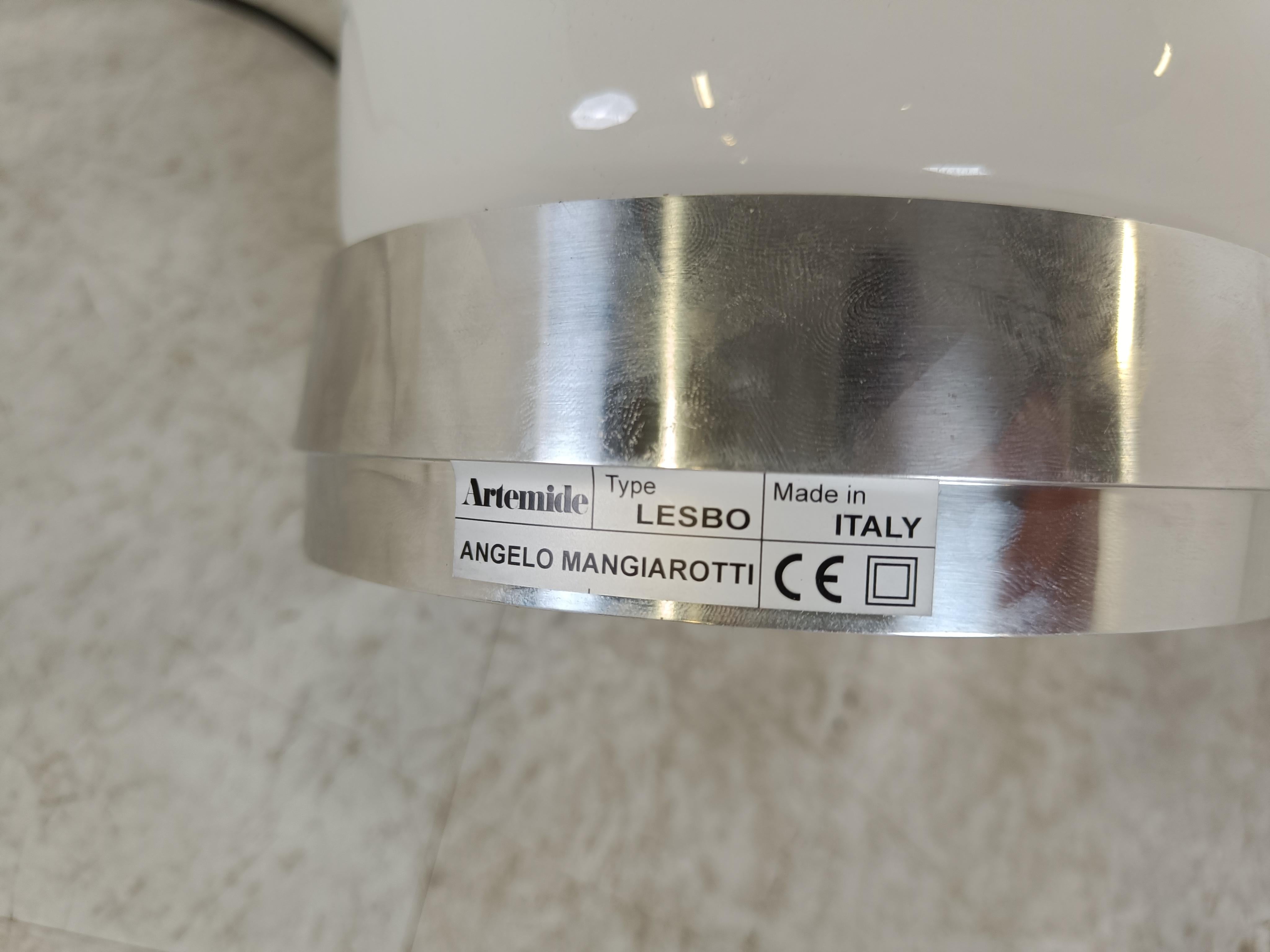 'Lesbo' table lamp designed by Angelo Mangiarotti in the 1960s.

This particular one was produced in the 1990s by Artemide.

Beautiful mushroom shaped murano glass lamp on a chromed metal base.

It has two lightpoints inside, and the cool feauture