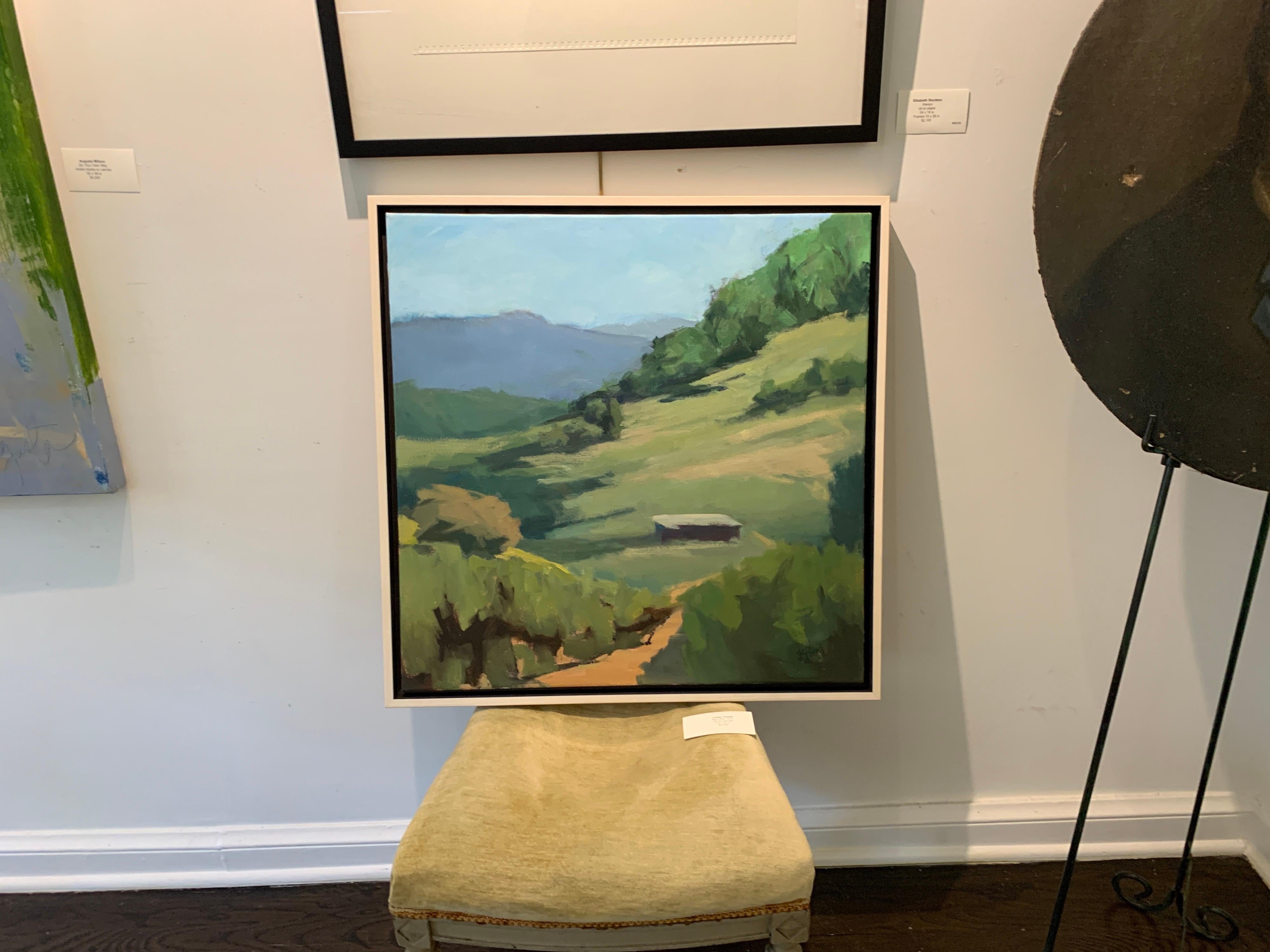 'Mountain Farm' is a framed Post-Impressionist oil on canvas painting created by American artist Lesley Powell in 2021. Featuring a palette made of green, blue and earth tones, the painting depicts a lovely view of the countryside, perched upon a