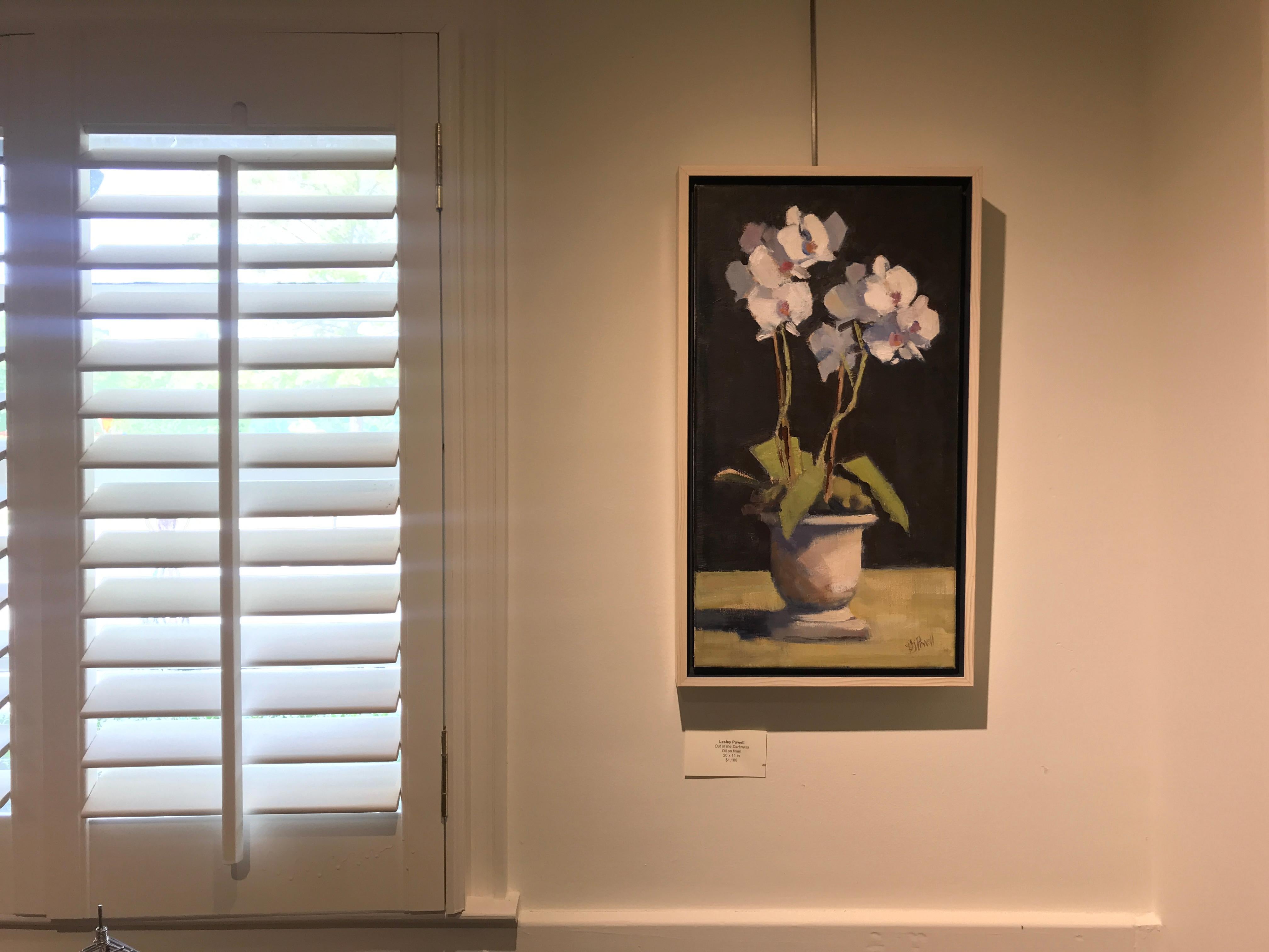 'Out of the Darkness' is a vertical Post-Impressionist floral oil on linen painting created by American artist Lesley Powell in 2018. Featuring a palette made of contrasting colors such as black, white, green and brown accented with discreet pink