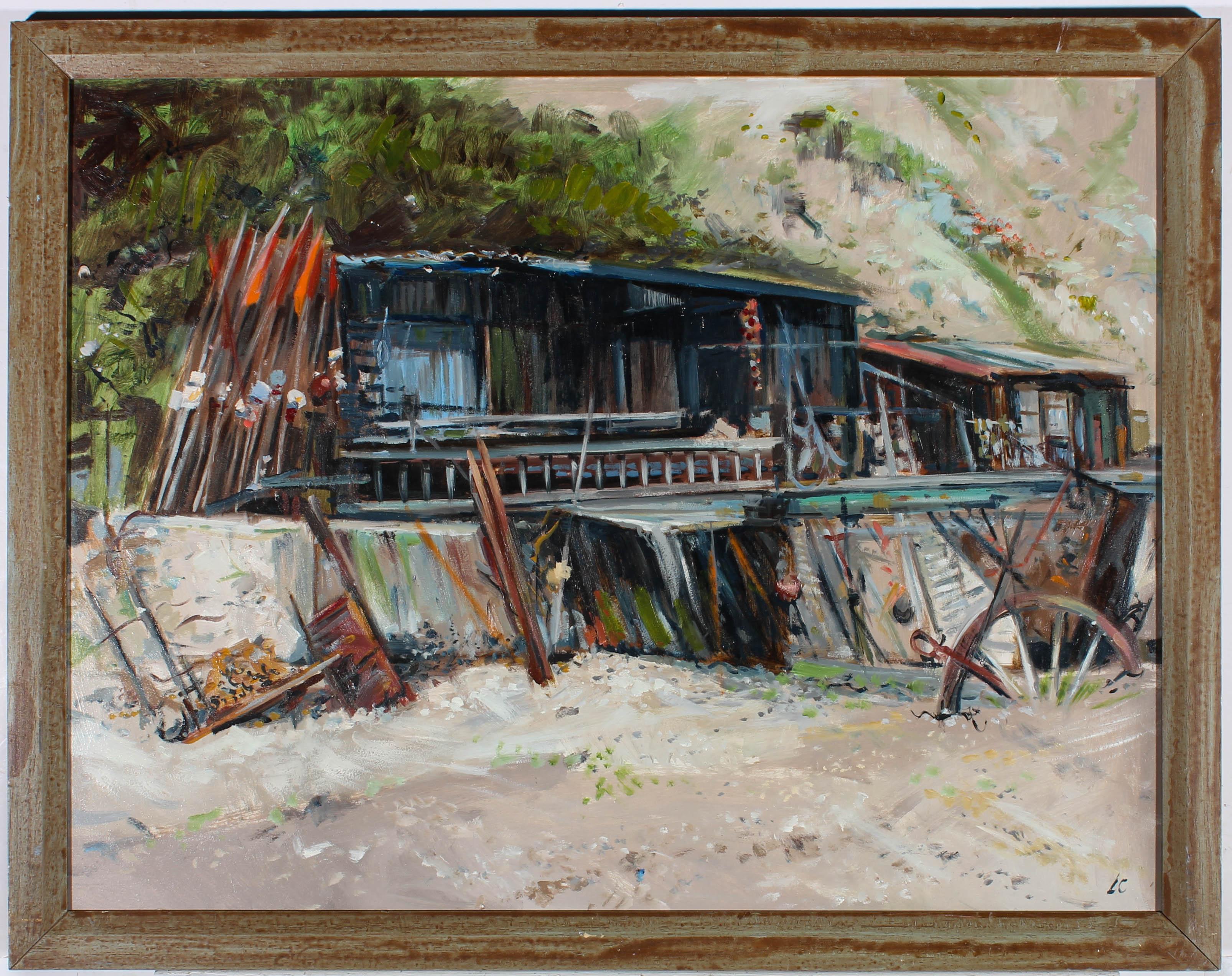 A fine contemporary oil scene showing a metal shack with machinery outside. The artist has initialed to the lower right corner and the painting has been presented in a distressed effect contemporary frame. On board.