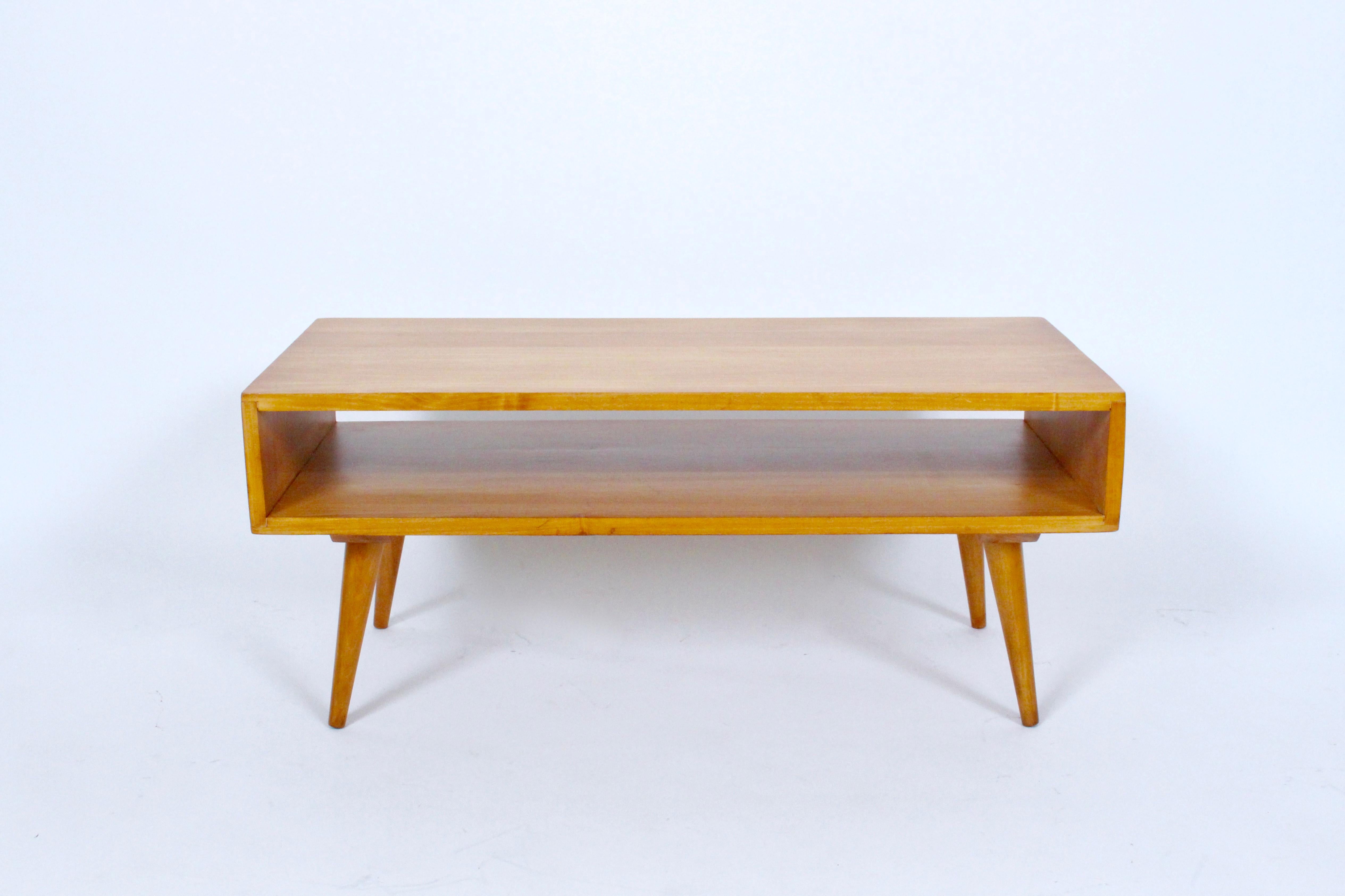 Early 1950s Leslie Diamond for Conant Ball attributed solid maple two-tier coffee table - bench. Featuring rectangular construction with lap joints, wooden screw dowel legs. Storage area 4.75 H. Compact. Great storage. Great with cushion. Magazines.