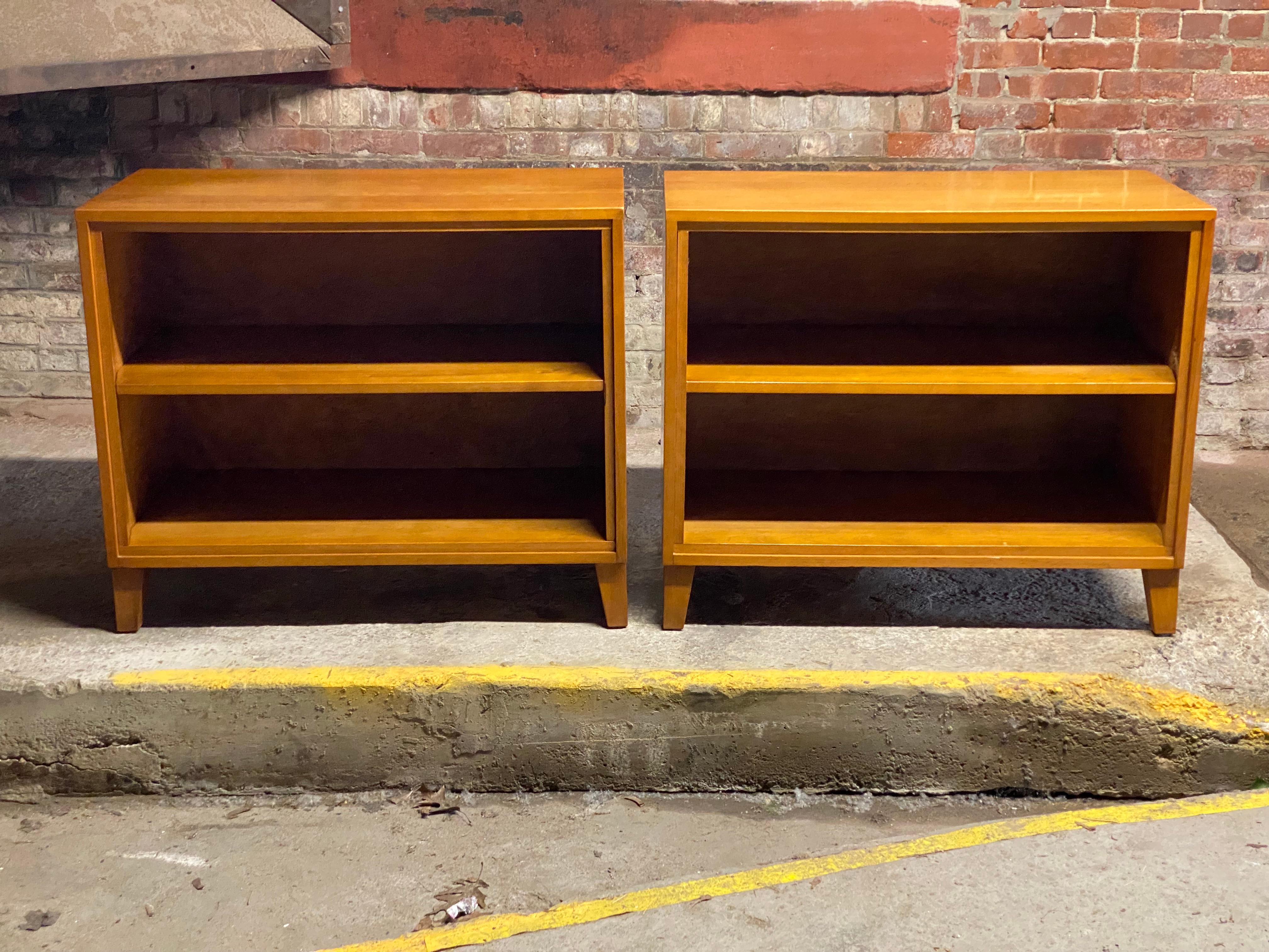 A fine pair of Leslie Diamond designed shelving units/bookcases for Conant Ball. The American Modern line was produced so the owner could mix, match and add on. Quality solid maple construction with adjustable height single shelf and tapered feet.