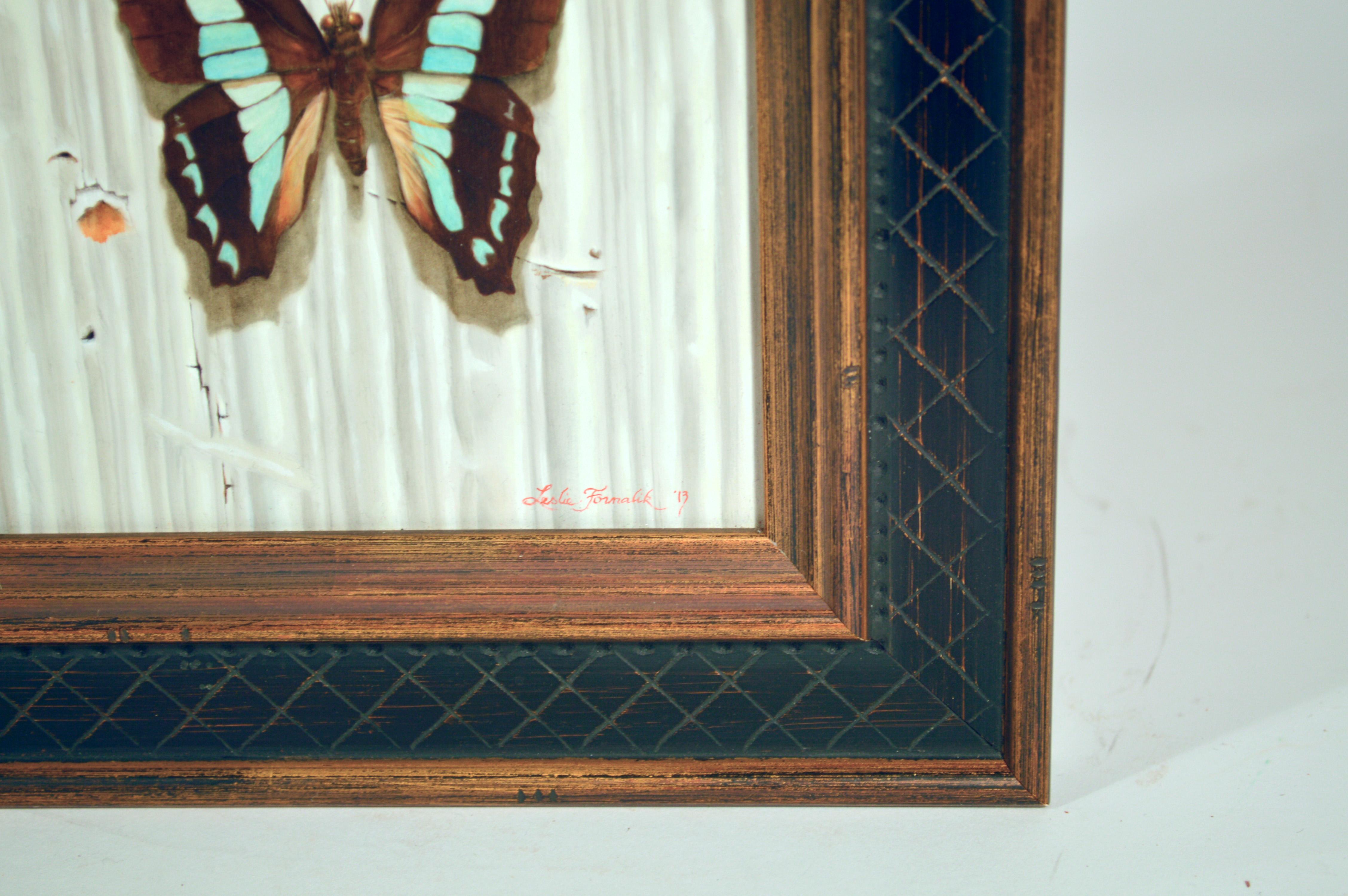 Leslie Formalik Trompe L'oeil paintings of butterflies,
Pair,
Dated 2013 and 2019

The pair of beautiful tromp l'oeil paintings each depict a different pinned butterfly against a faux wood ground. One signed Leslie Formalik, 2013 and one Leslie