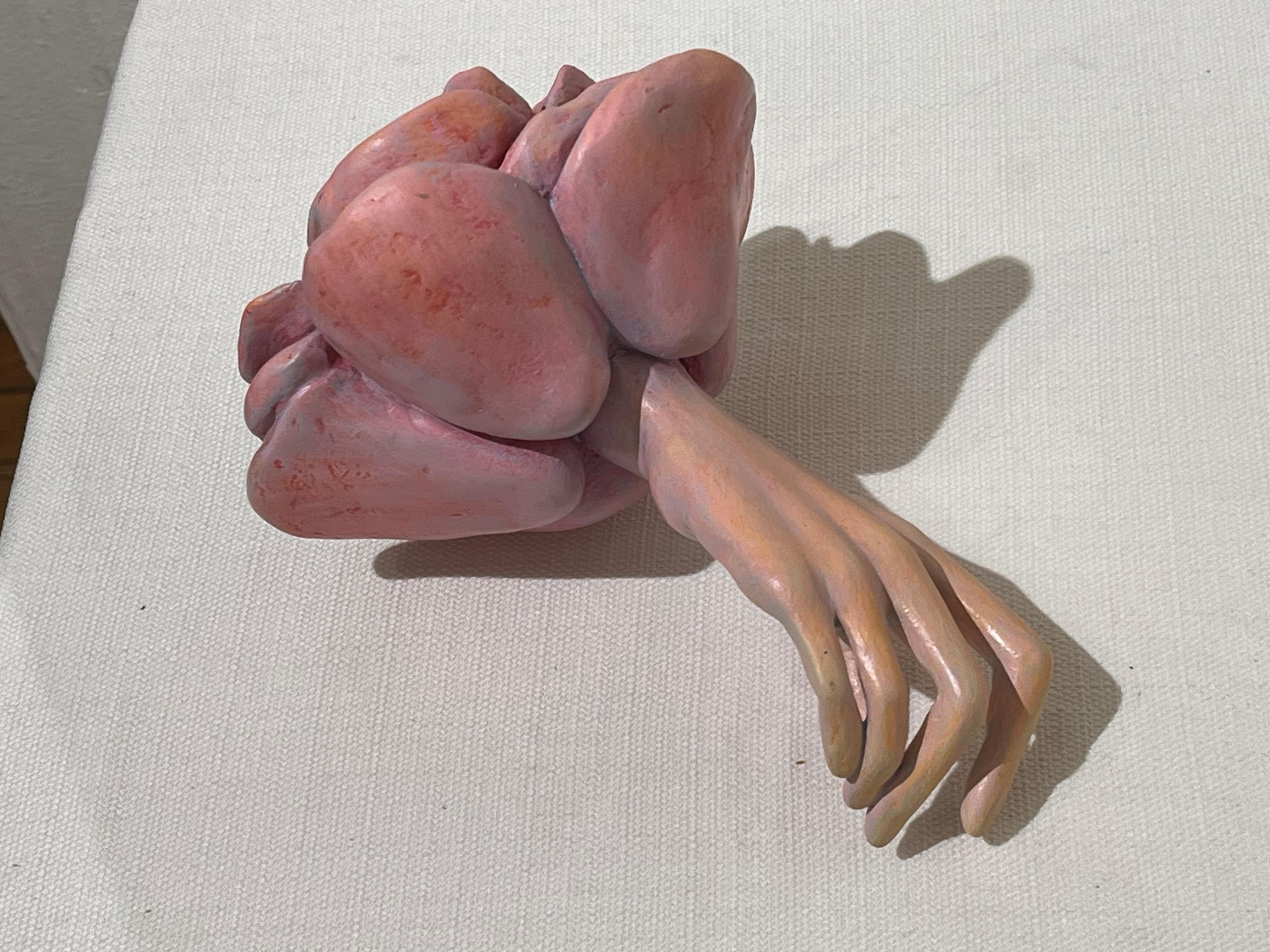 Leslie Fry, Senza titolo (Ammanettato 2), scultura fantastica rosa di mano femminile