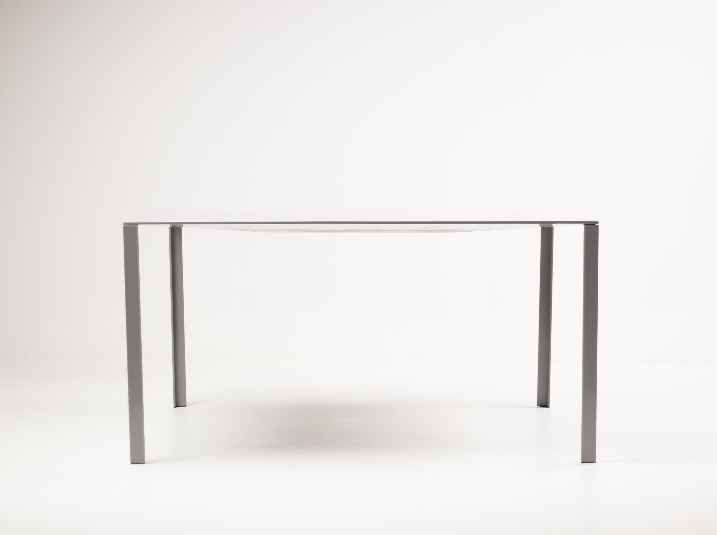 Early enameled steel example of the Jean Nouvel Less table. 
Manufactured by Unifor. A table the strength of which lies in a play on corners and folds. 
Designed originally for the foundation Cartier in Paris.


 