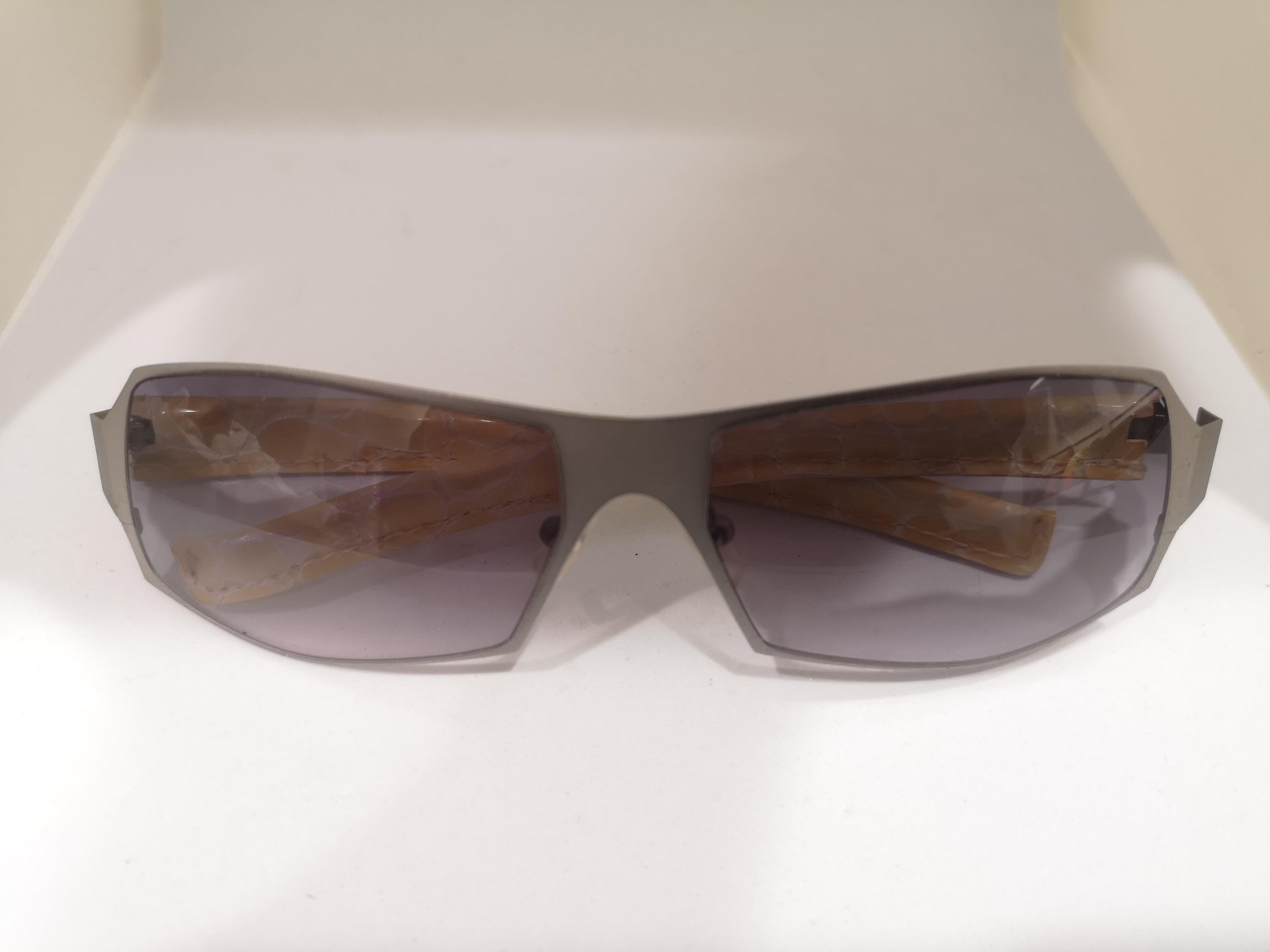 Gray Lessthanhuman purple lens yellow snake skin and silver sunglasses