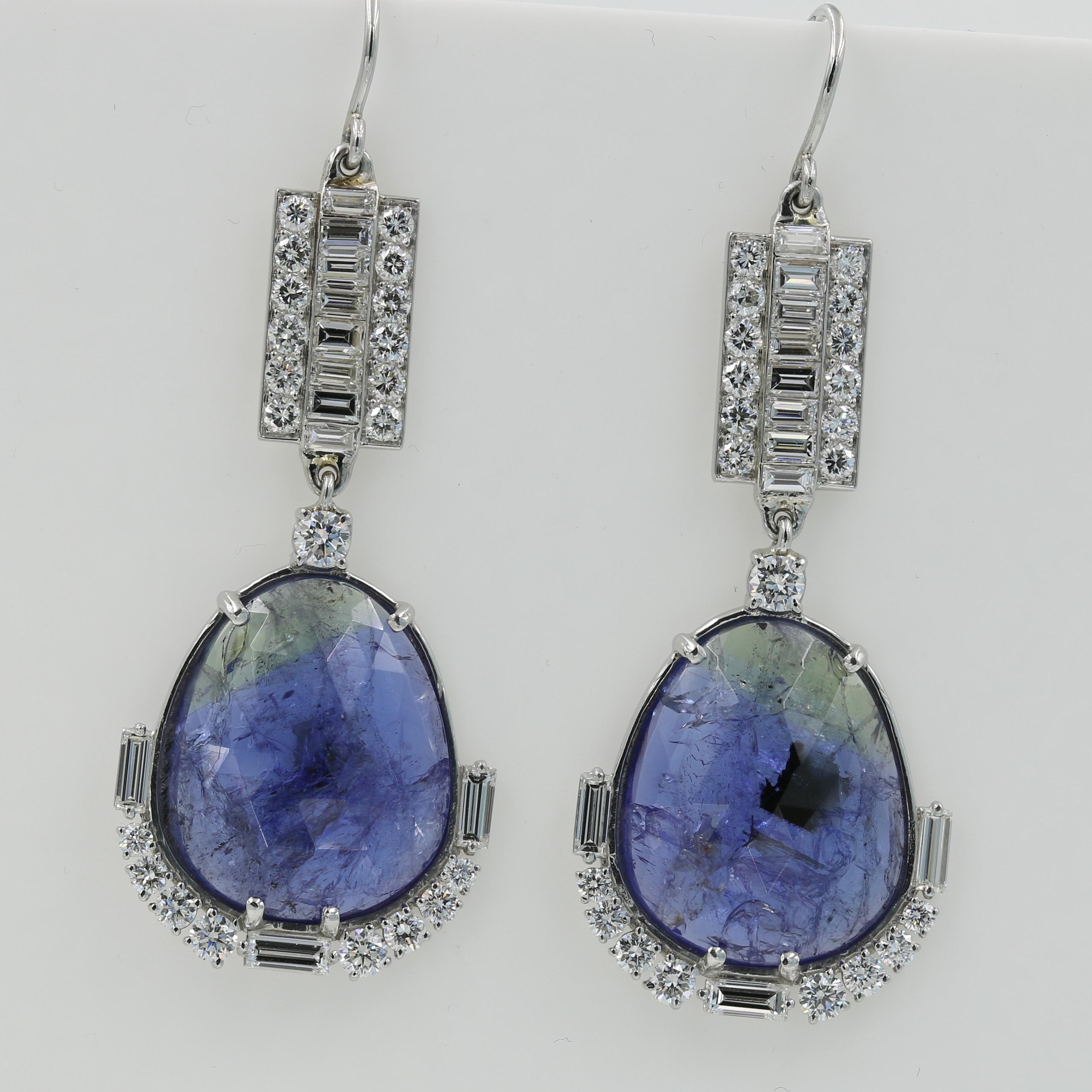 Lester Lampert one-of-a-kind Tanzanite and Diamond Drop Earrings in Platinum - 

Featuring two slice cut Tanzanites weighing 26.56cts. total. The earrings are accented by 18 ideal cut round diamonds =1.20cts. total (G-VS), 24 Round diamonds =