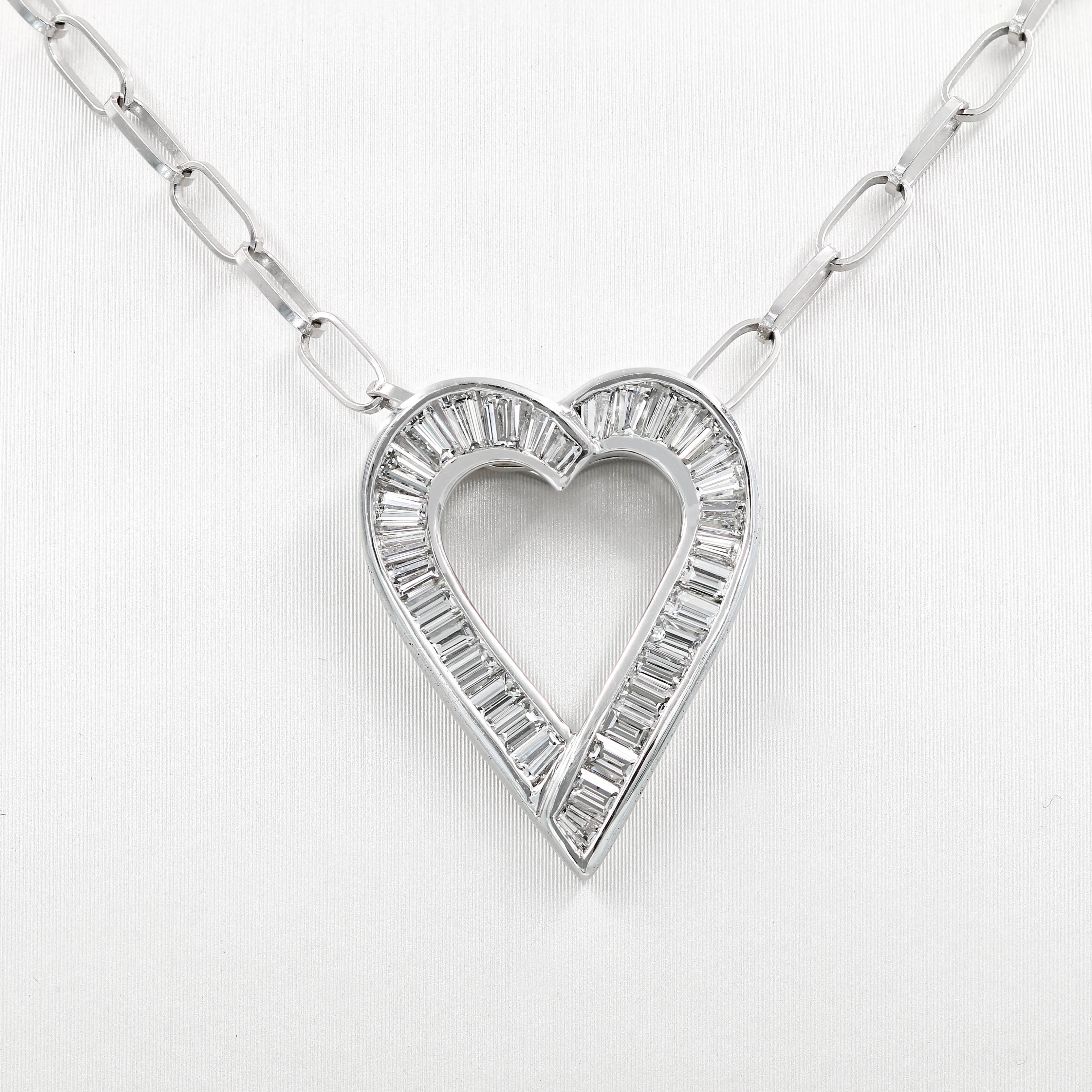 This elegant baguette diamond heart shape necklace in 18kt. white gold is a custom crafted Lester Lampert original. It contains 31 baguettes= 1.68cts. t.w.  (the diamonds are G in color and VS clarity)

The piece is suspended from an 18kt. white