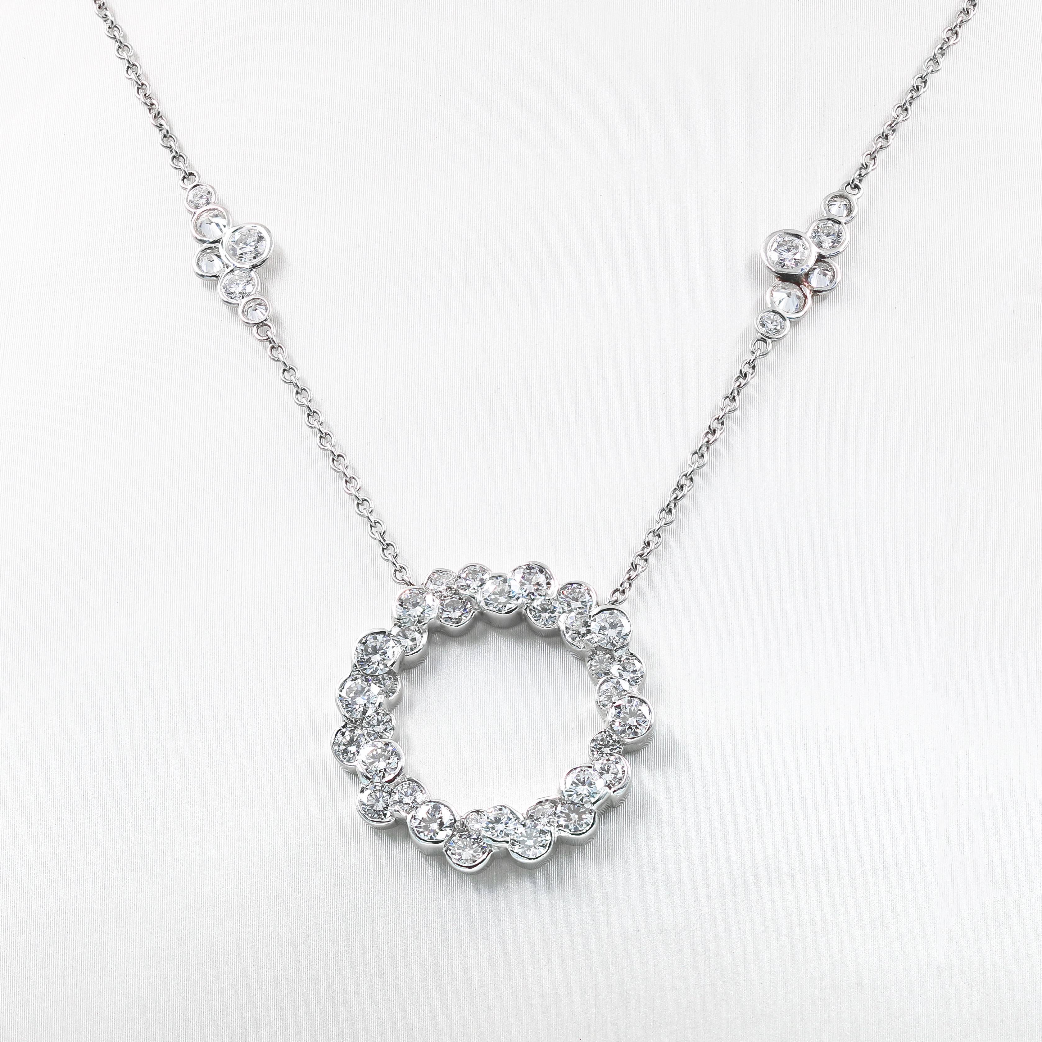 This one-of-a-kind custom crafted Lester Lampert CumuLLus® and Pirouette™ necklace is set in platinum. It has a large diamond circle, with 2 medium, and 2 large Pirouette™ sections.  The circle has 33 ideal cut round diamonds= 3.01cts. t.w.  The