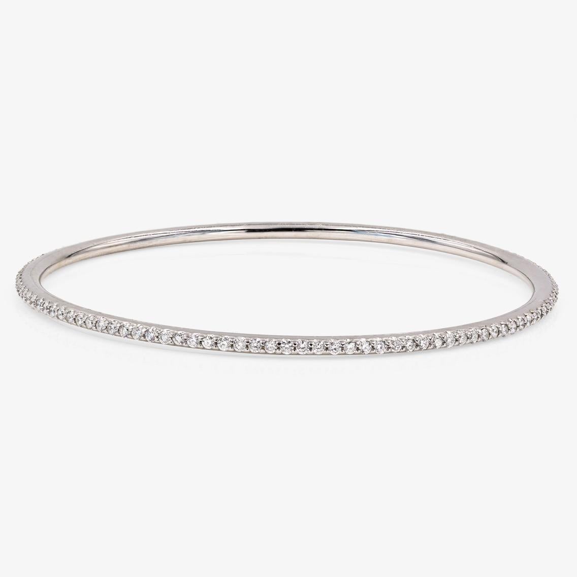 This Lester Lampert original D-Bead™ style bangle bracelet in 18kt. white gold contains 114 ideal cut round diamonds = 1.90cts. t.w. There is no clasp.

Every Lester Lampert piece will arrive in an elegant custom jewelry box.