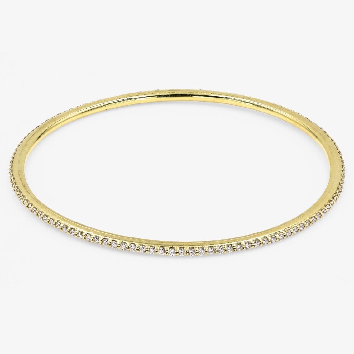 This Lester Lampert original D-Bead™ style bangle bracelet in 18kt. yellow gold contains 114 ideal cut round diamonds = 1.84cts. t.w. There is no clasp.

Every Lester Lampert piece will arrive in an elegant custom jewelry box.